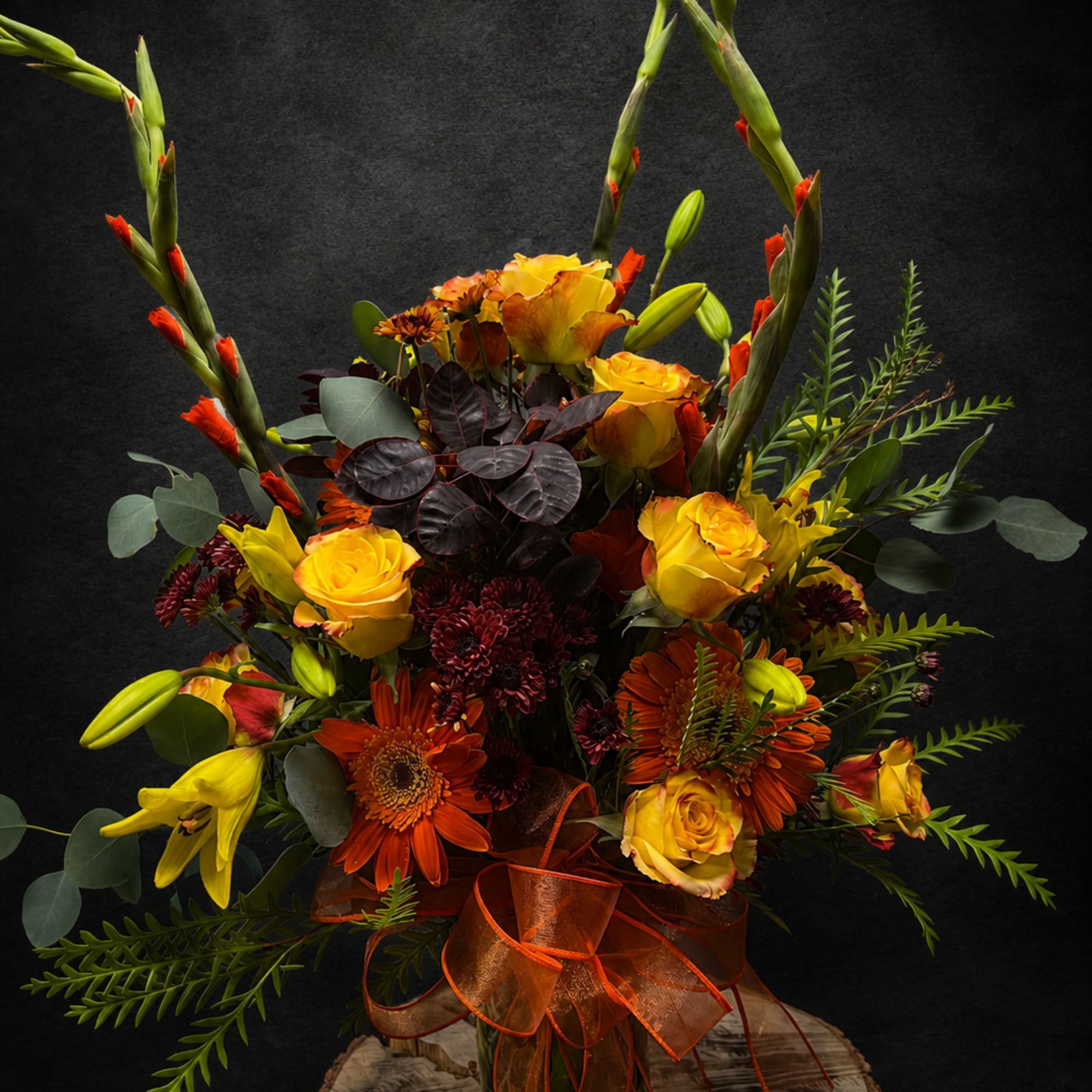 A tall, sculptural autumn bouquet that reads like a sunrise-rich yellow roses