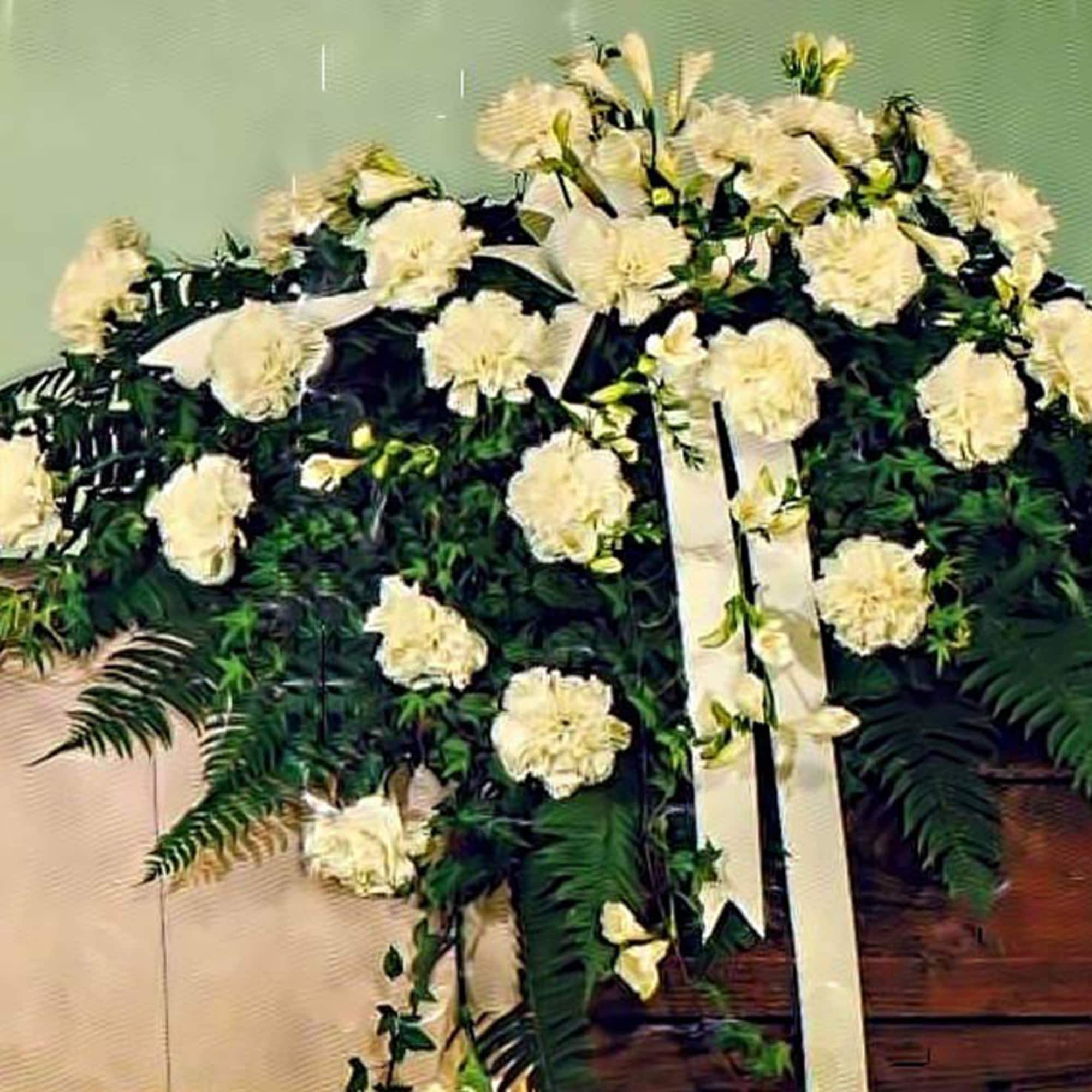 This elegant and classic casket spray is highlighted with white carnations and, photo 2 of 2