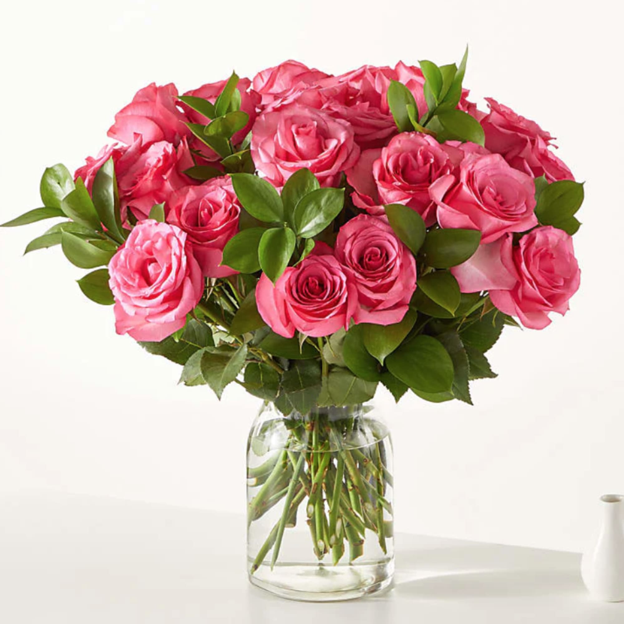 Pink rose bouquet in a clear glass vase
