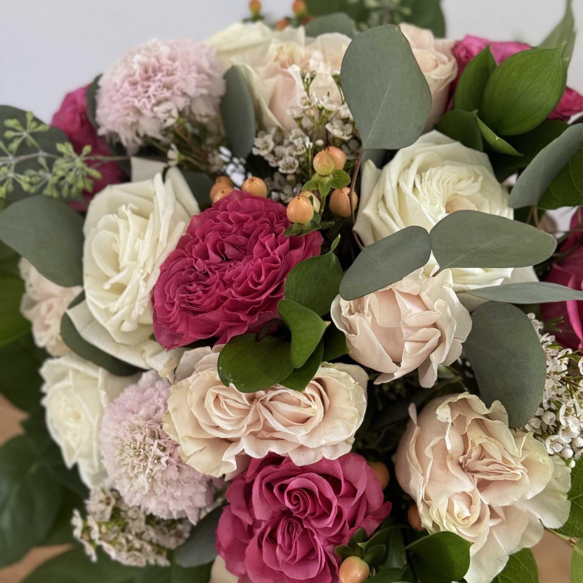 Bouquet of pink and white roses with eucalyptus