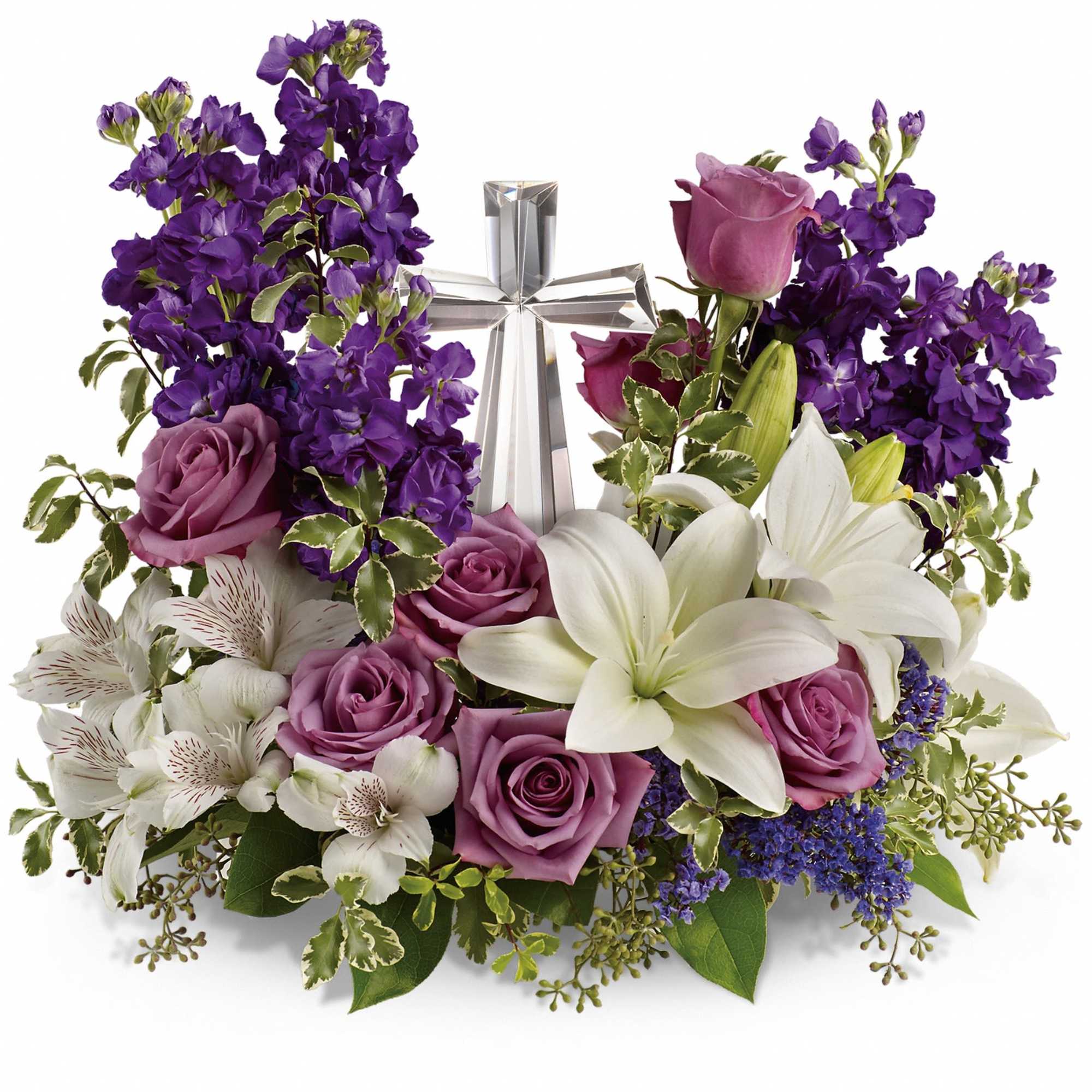 Purple and white floral arrangement with a silver cross centerpiece