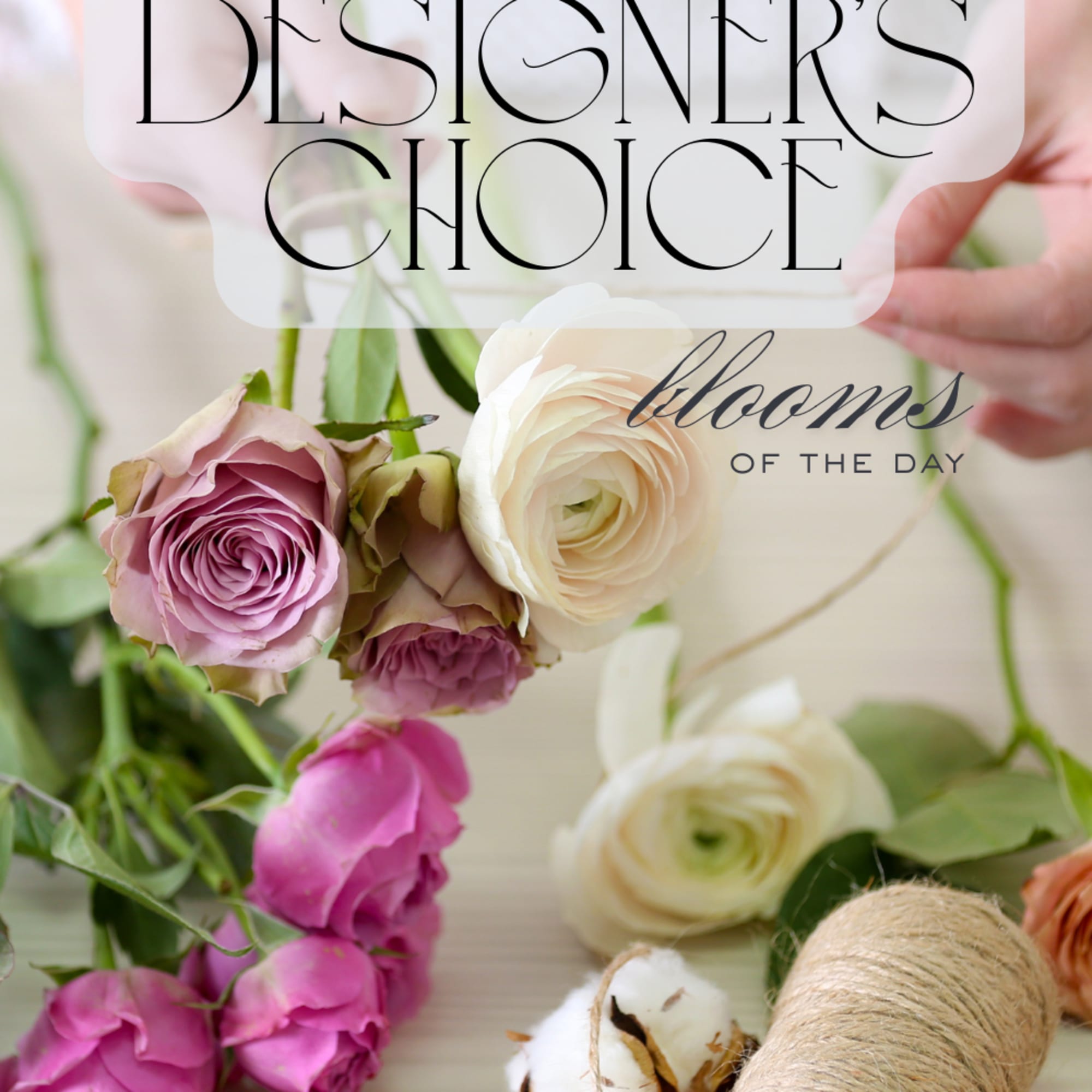 Loose pink and cream roses and ranunculus with twine and cotton labeled designer's choice blooms of the day