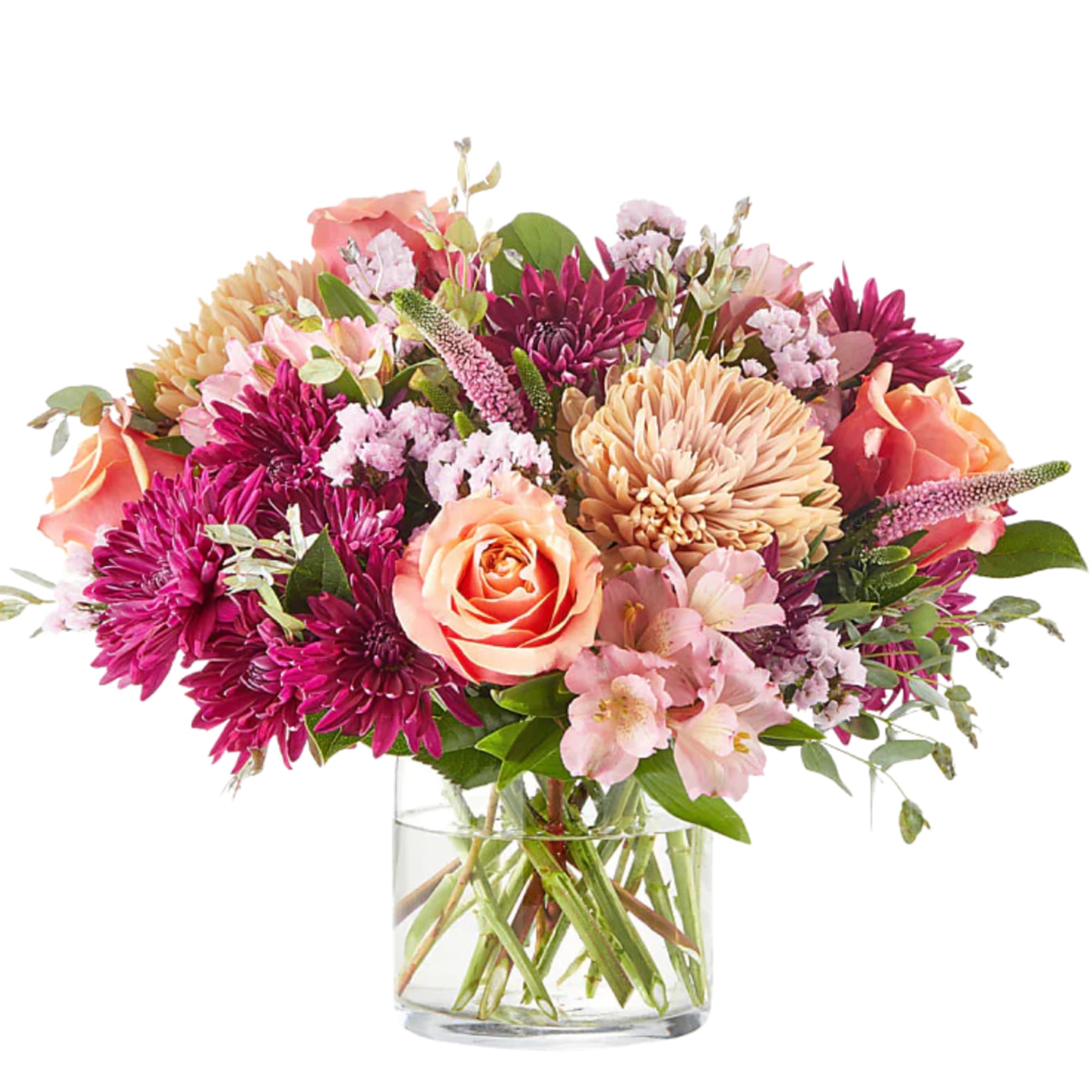 Mixed bouquet of peach roses, pink chrysanthemums, and alstroemeria in a clear glass vase