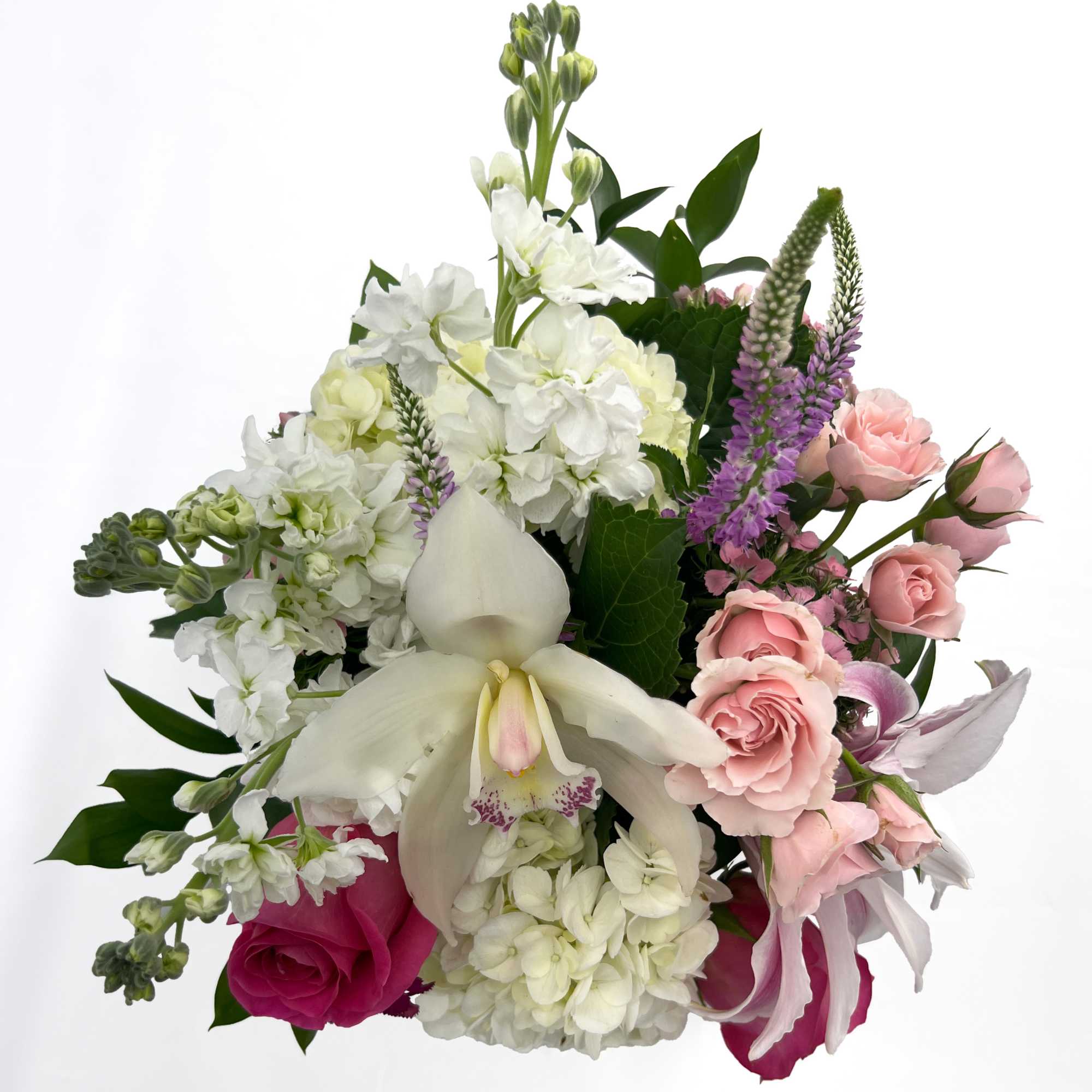 Bright pink roses and pale pink lilies take center stage in this, photo 3 of 3