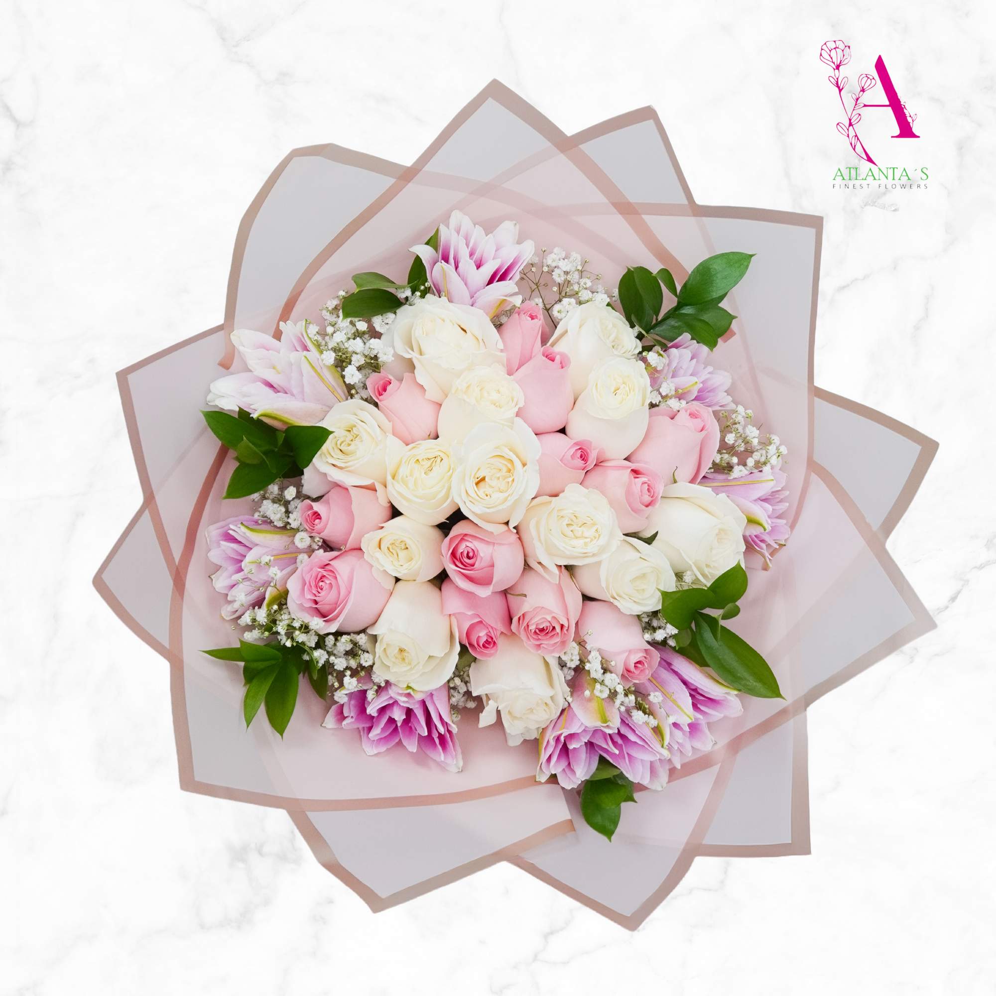 Bouquet of pink and white roses with small white filler flowers