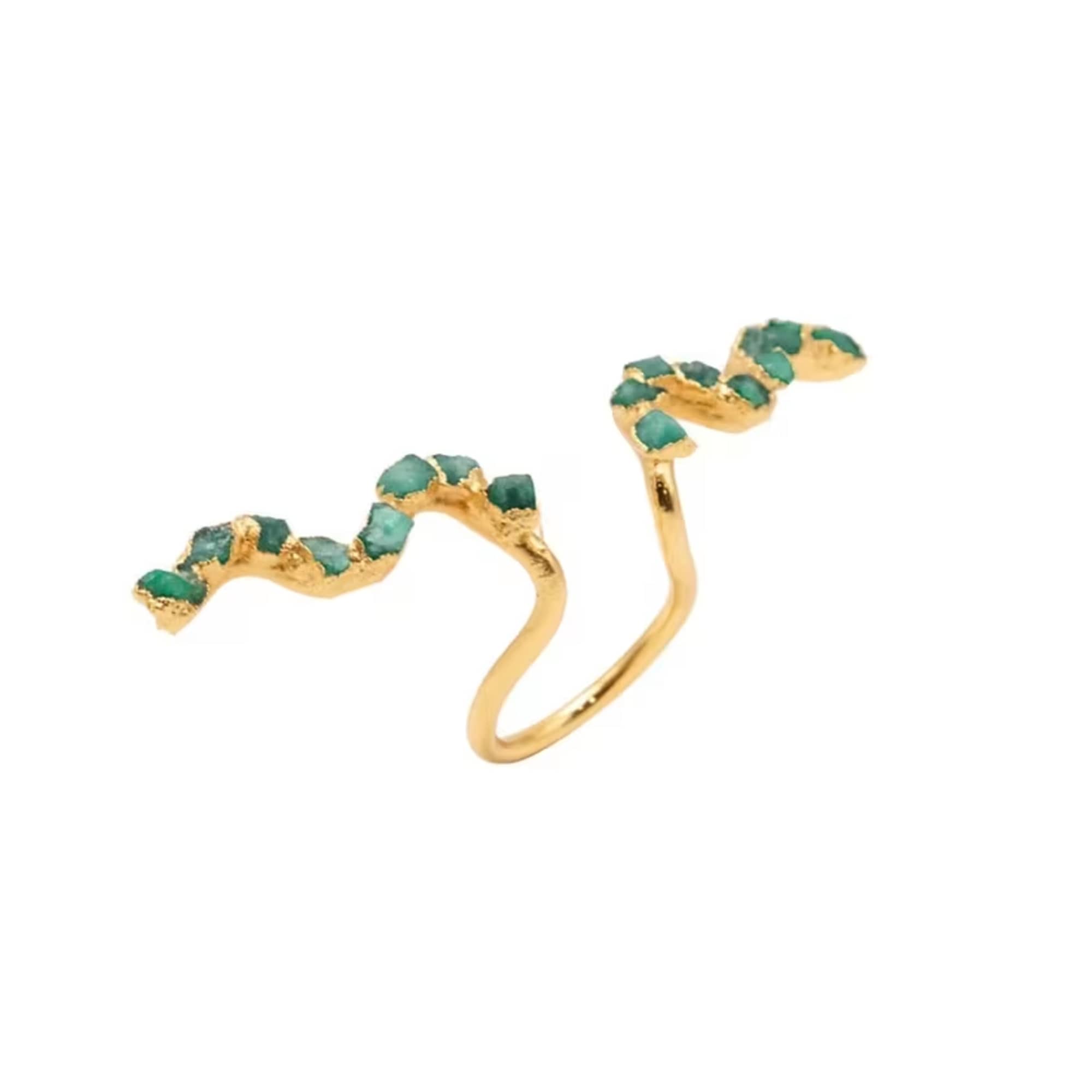 Gold ring with two green stone accents