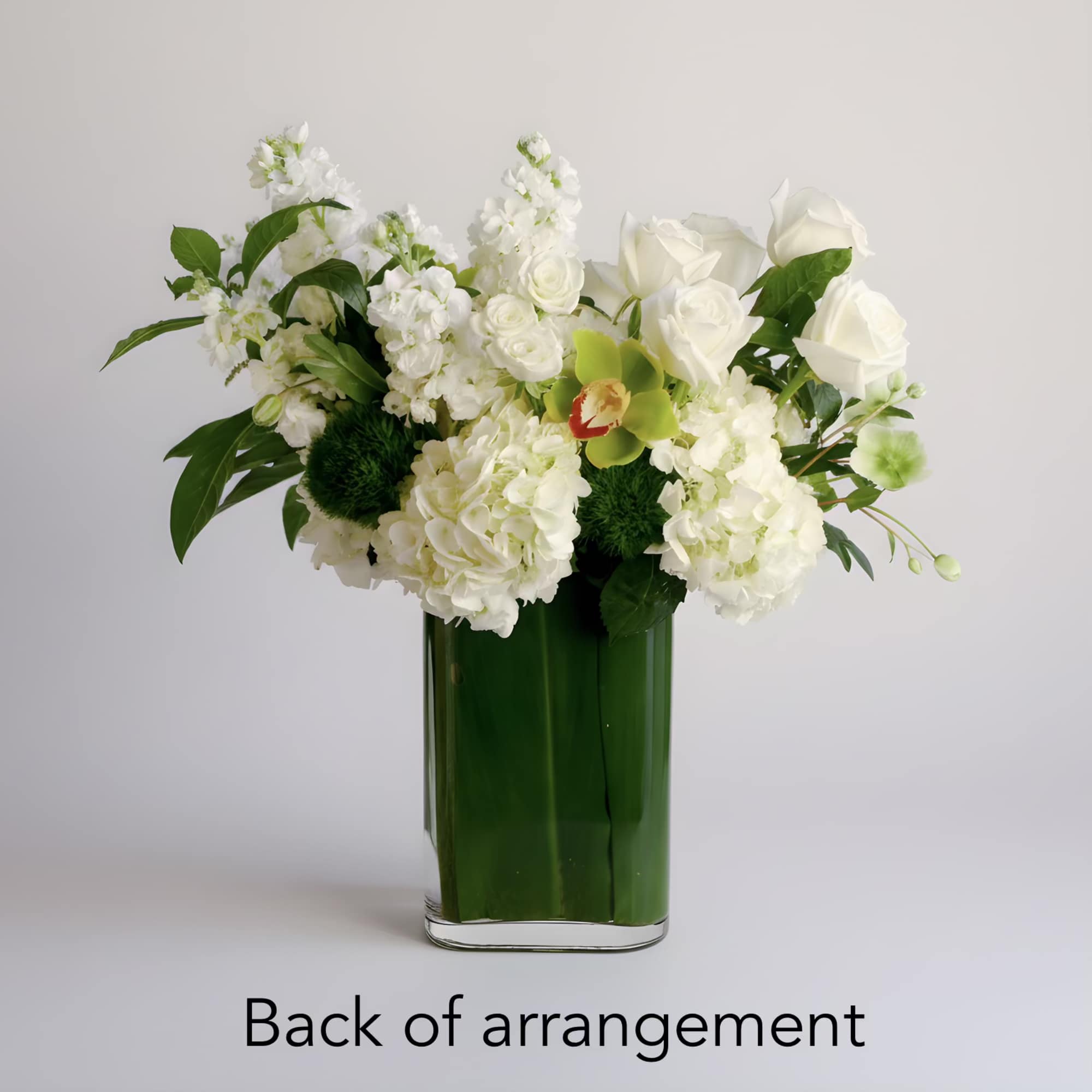 This modern arrangement features an elegant collection of green cymbidium orchids, white, photo 2 of 2