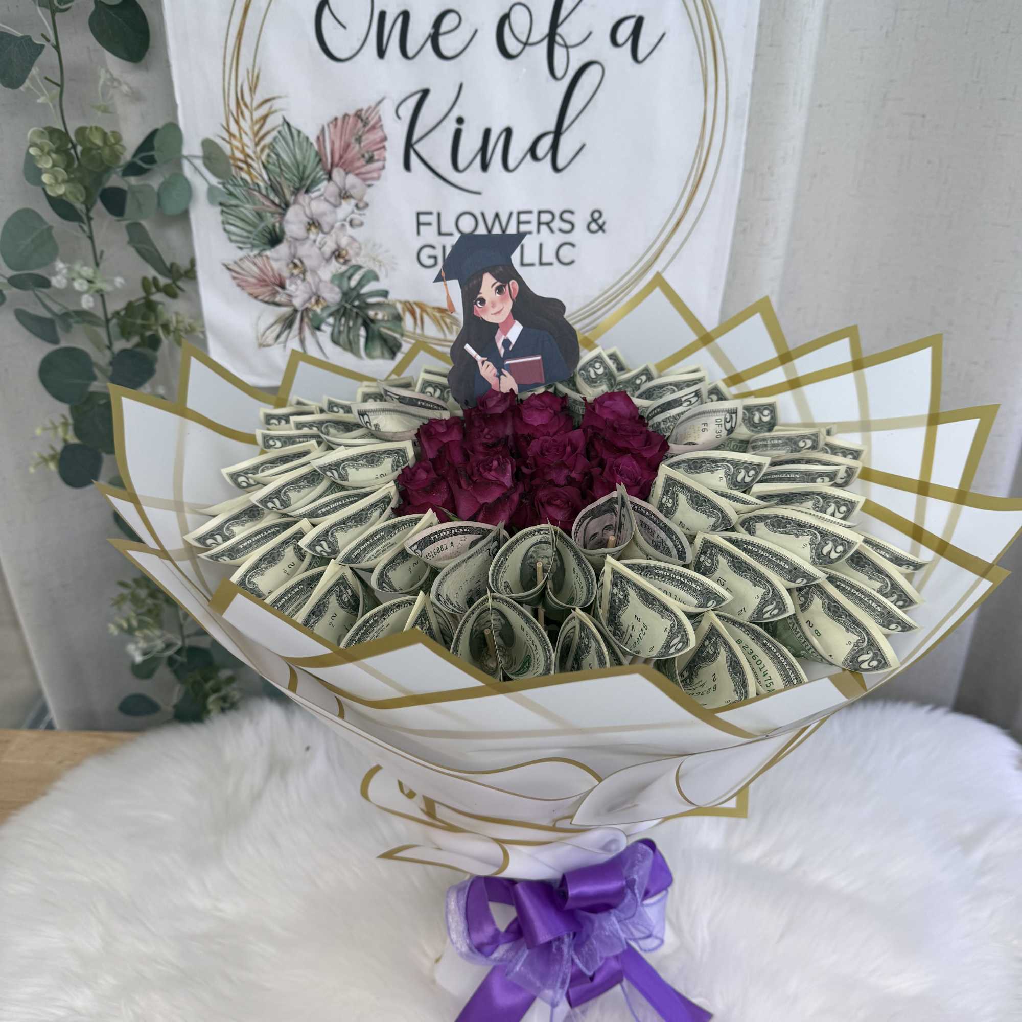 A luxurious bouquet made with a dozen real roses and real $1