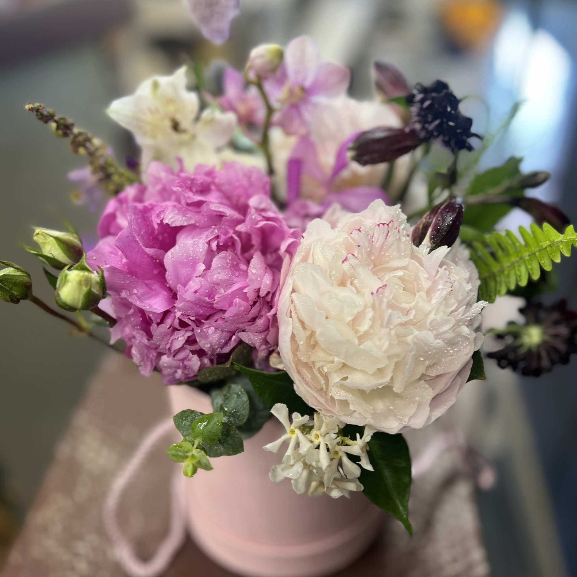 Pink and white peonies in a blush mug-style vase