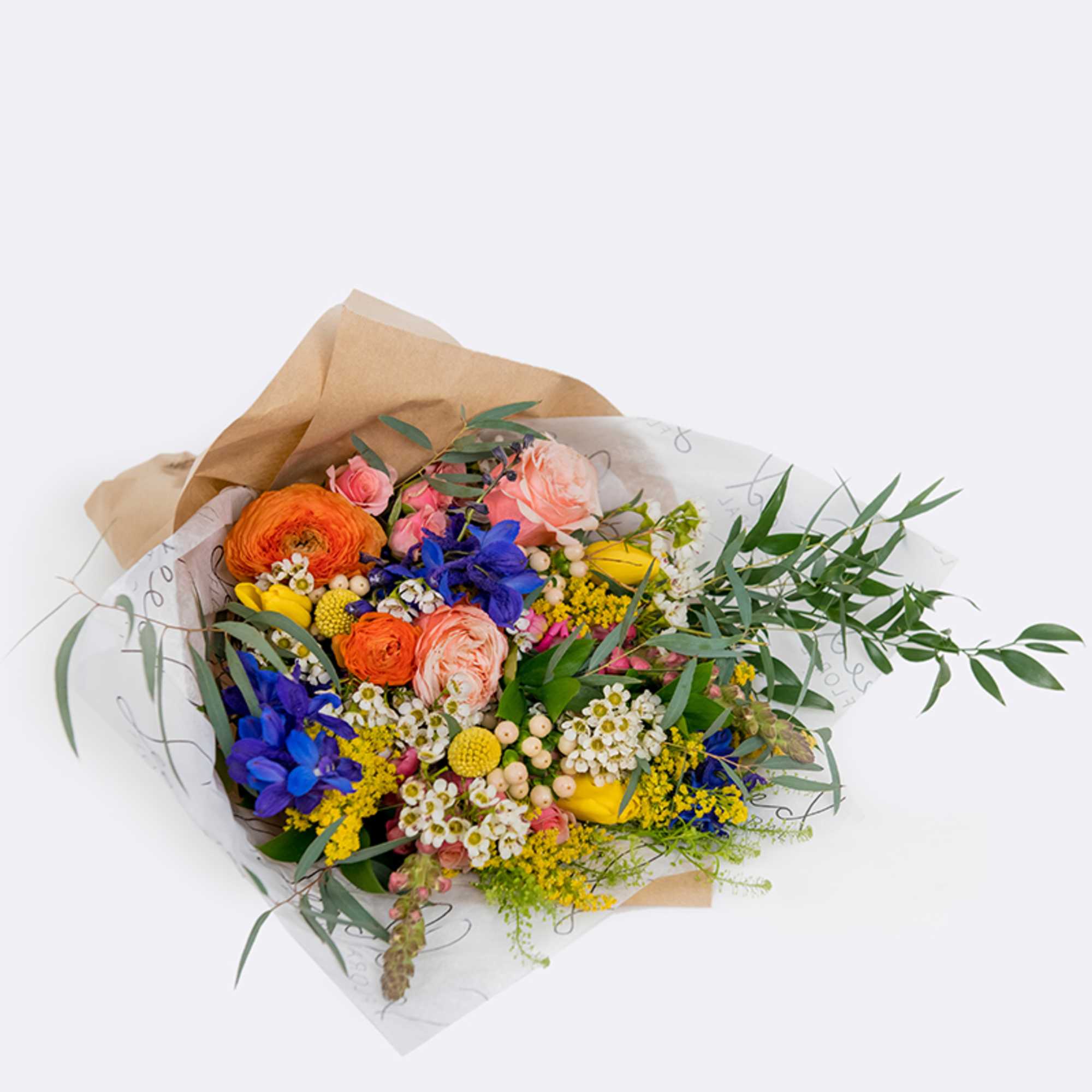 Mixed bouquet of orange, pink, blue, and yellow flowers wrapped in paper