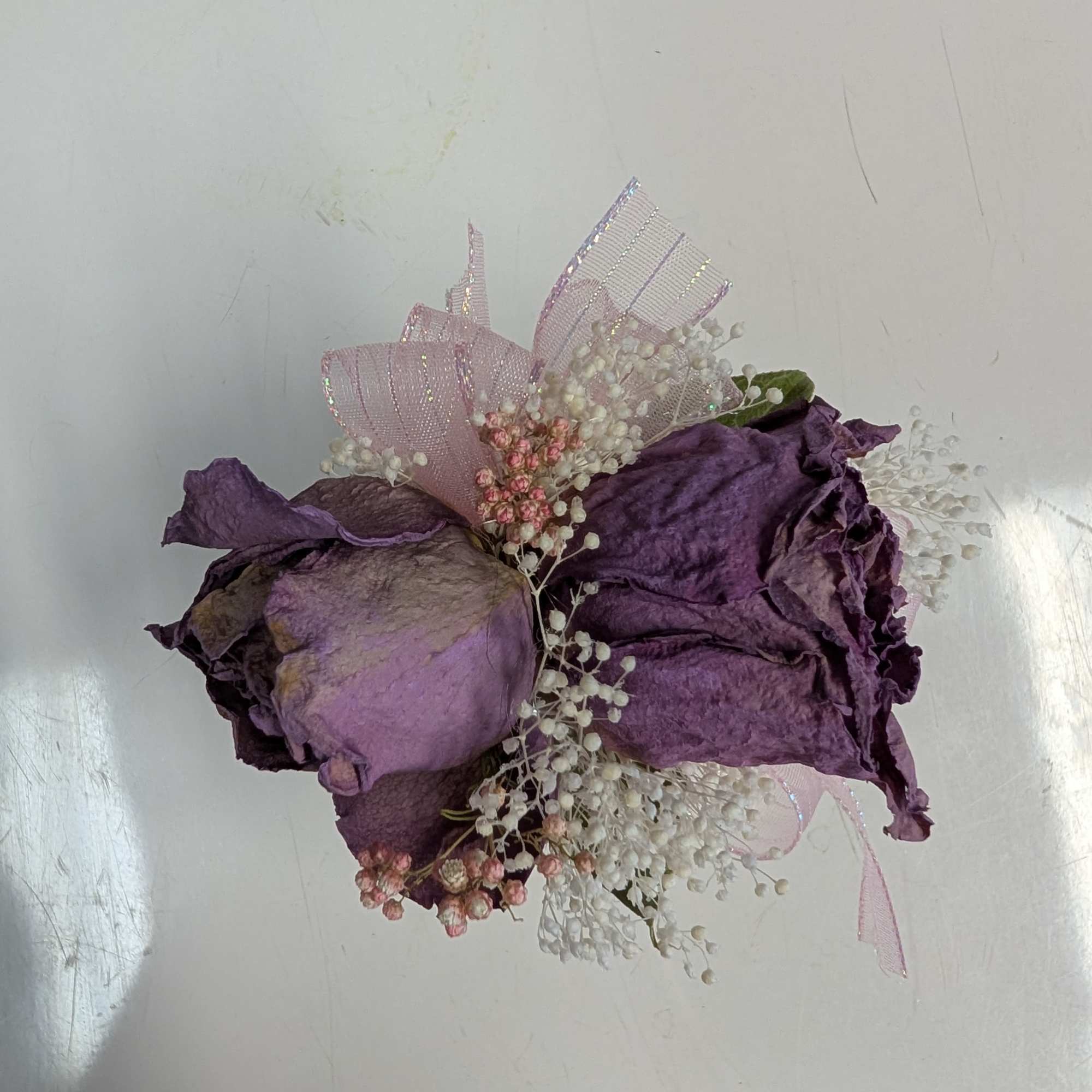 A forever keepsake. This silver bracelet is dressed up with dried roses, photo 3 of 3