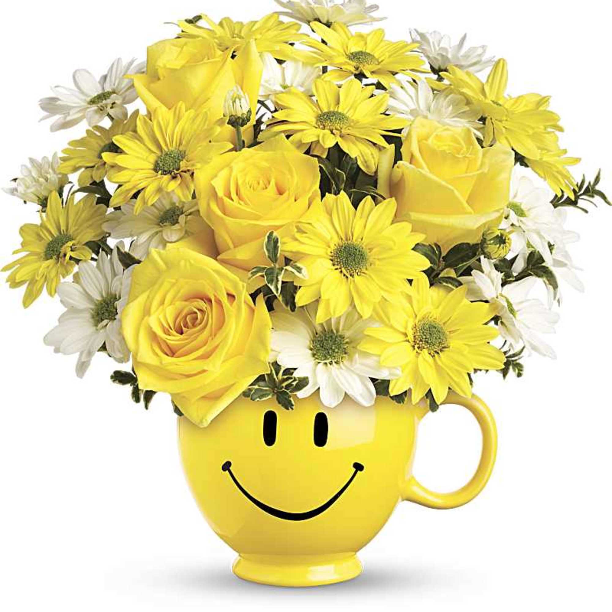 Yellow and white daisy mums and roses arranged in a yellow smiley-face mug.