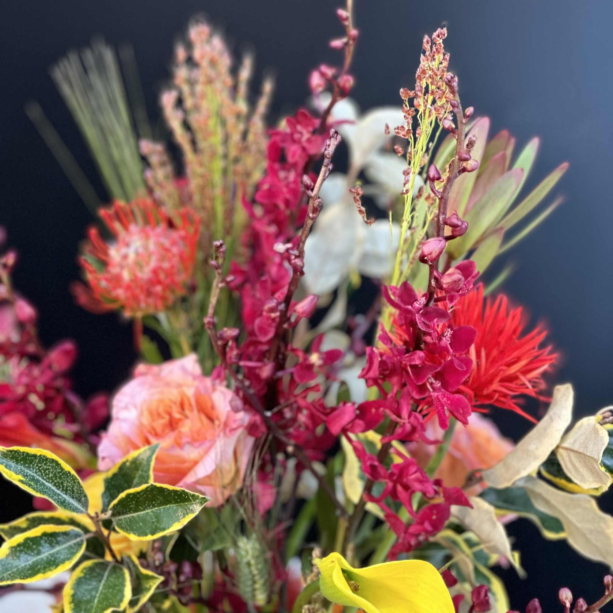 Bright mixed bouquet with pink, red, yellow, and white flowers