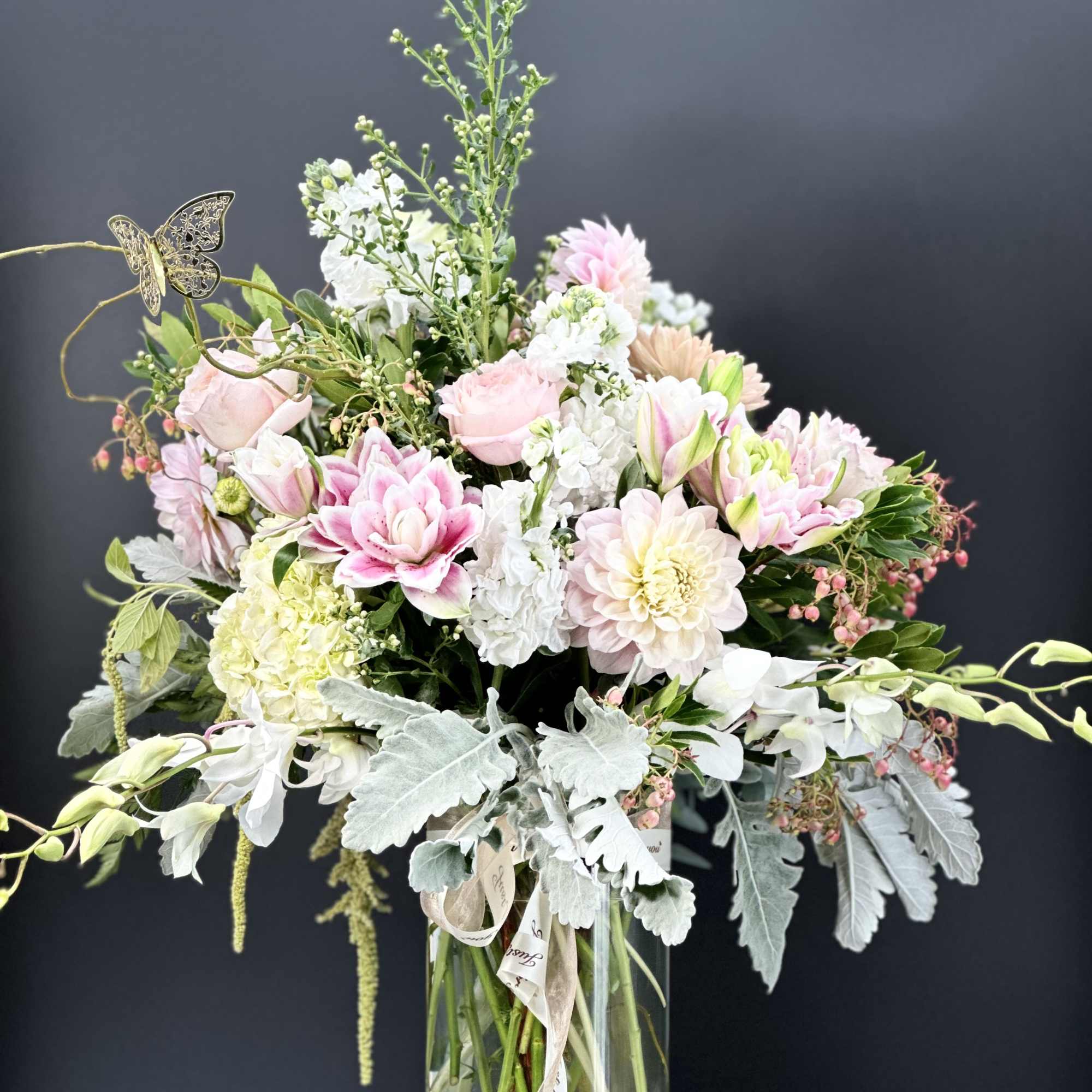 Pink and white mixed bouquet in a clear glass vase