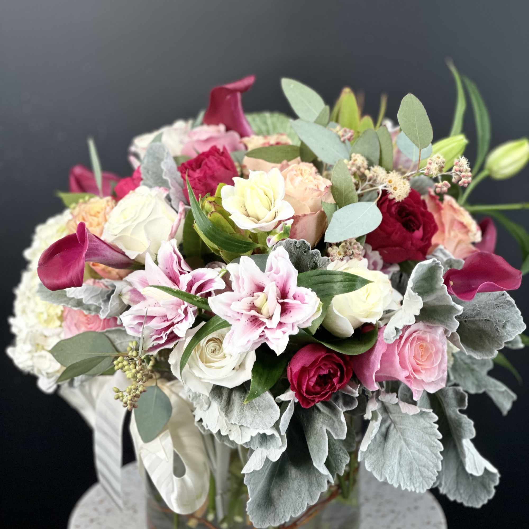 Mixed pink and white bouquet in a clear glass vase
