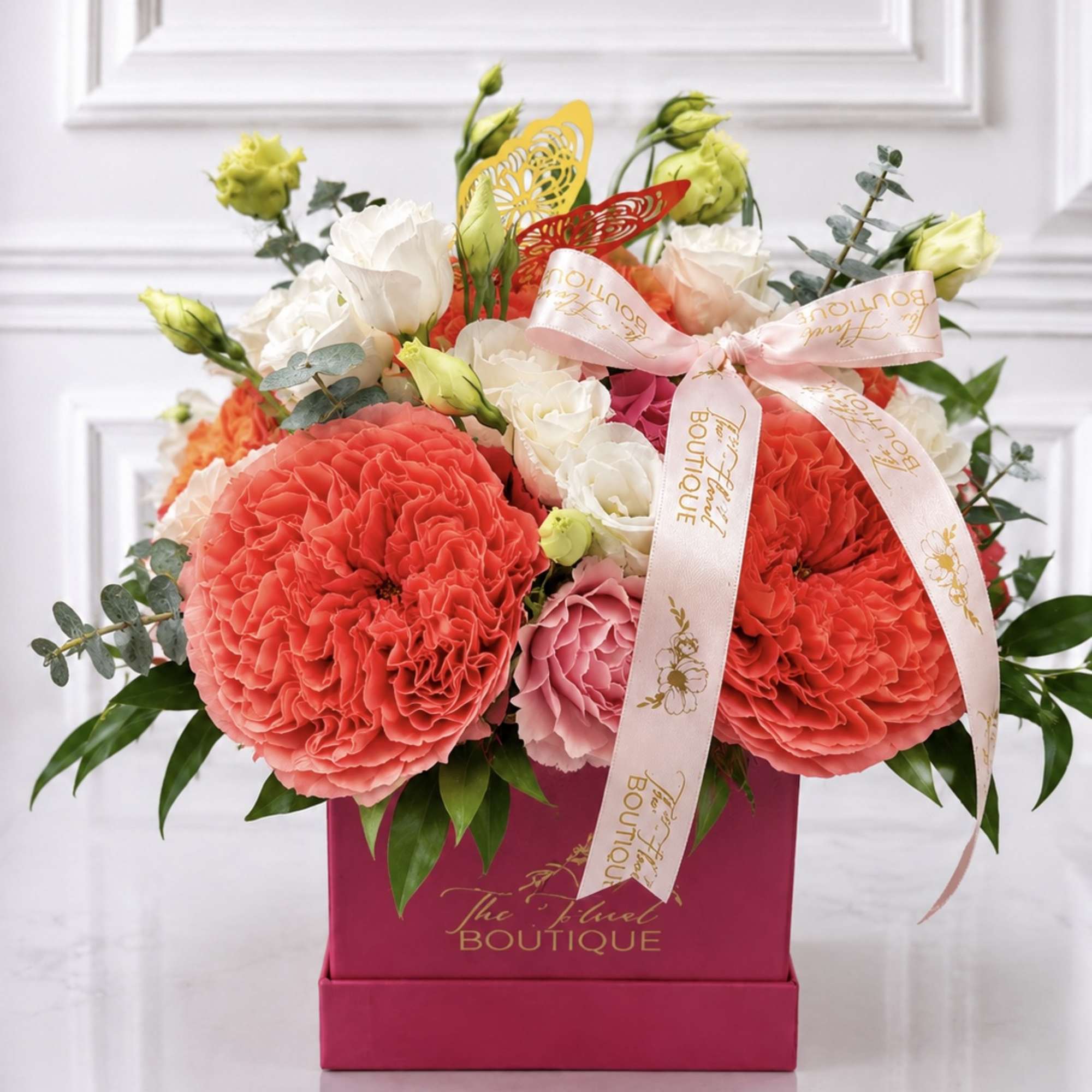 Pink and white bouquet in a magenta box with ribbon