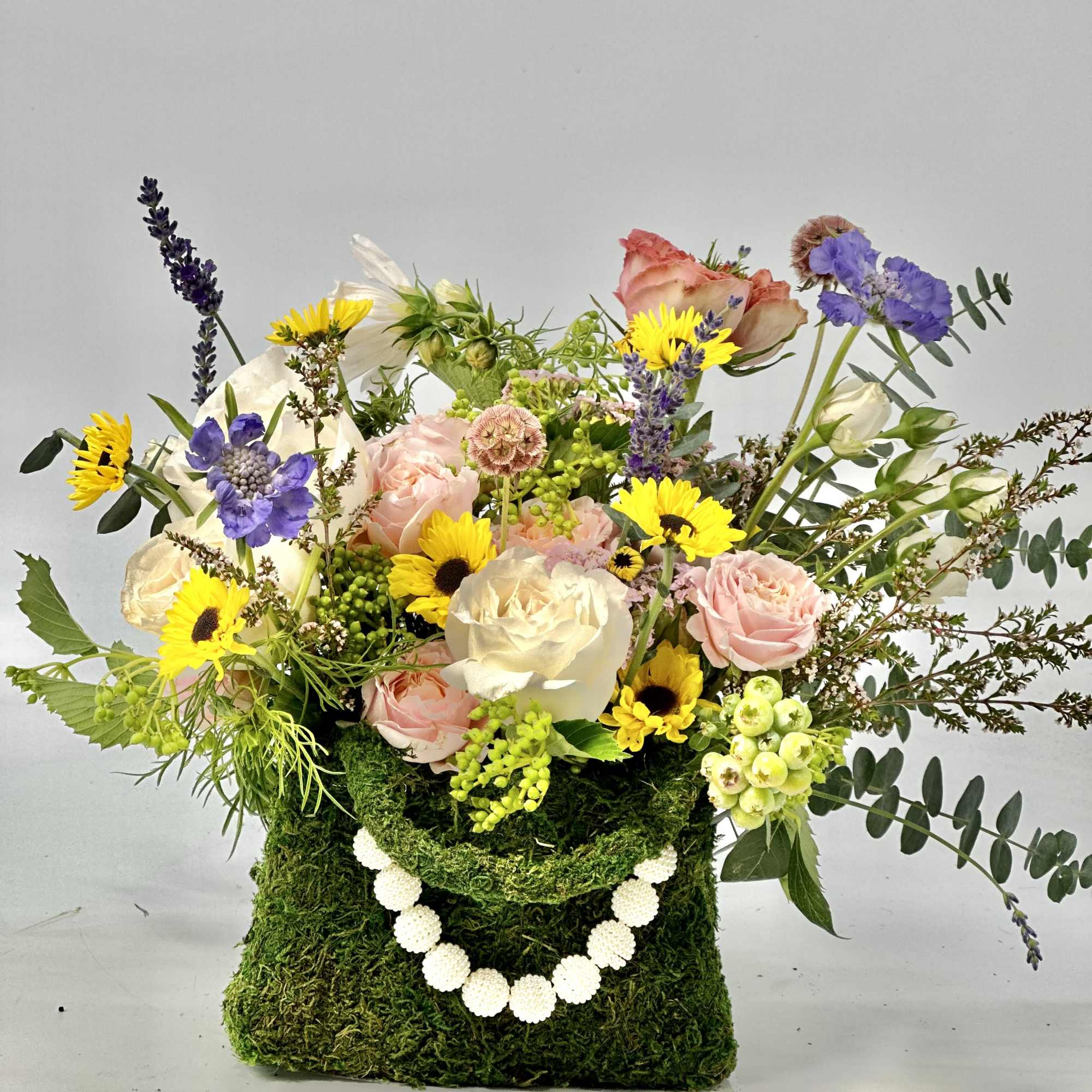 Refined ,low -profile floral arrangement composed of blush and rose -toned layered, photo 3 of 8
