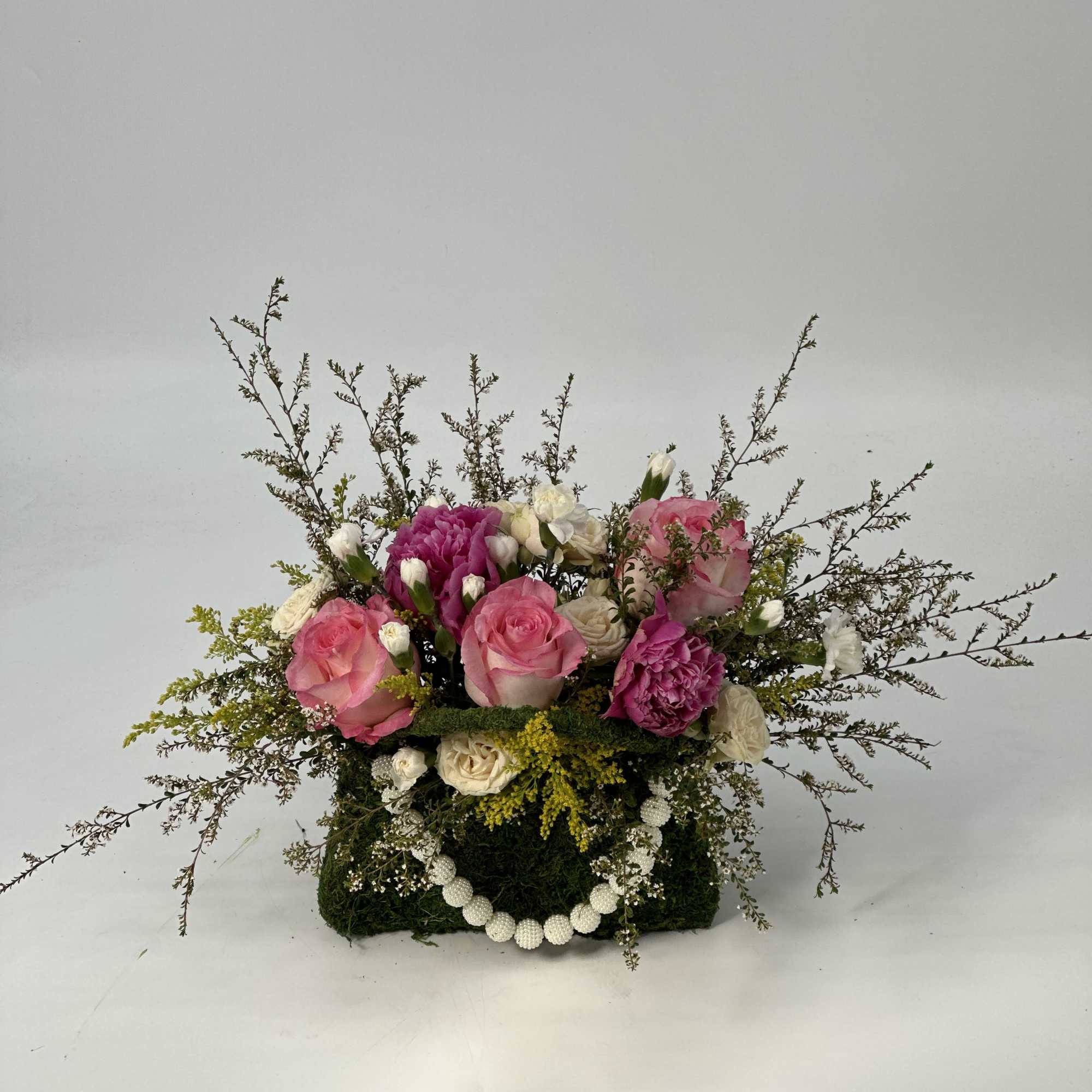 Refined ,low -profile floral arrangement composed of blush and rose -toned layered, photo 7 of 8