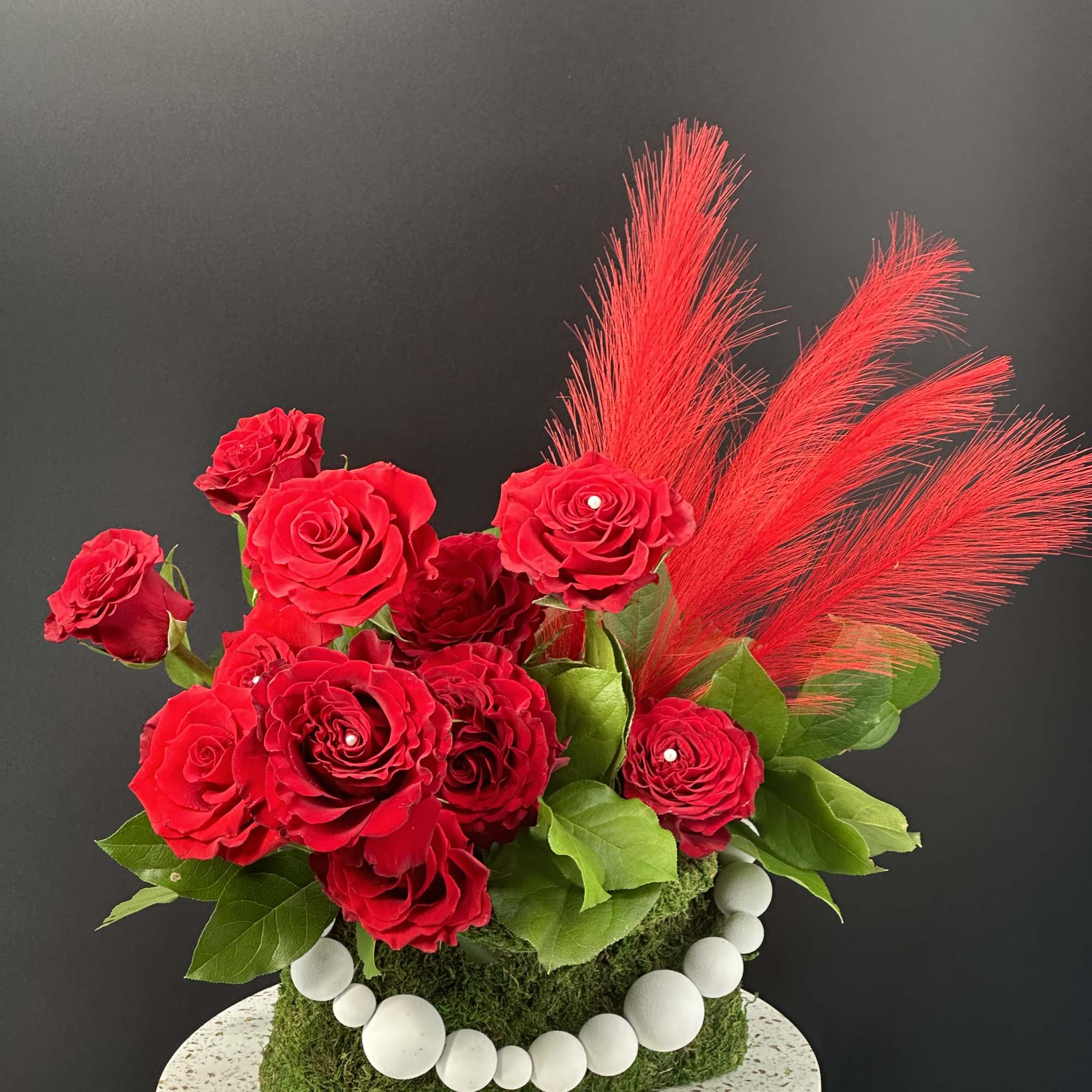 Refined ,low -profile floral arrangement composed of blush and rose -toned layered, photo 2 of 8