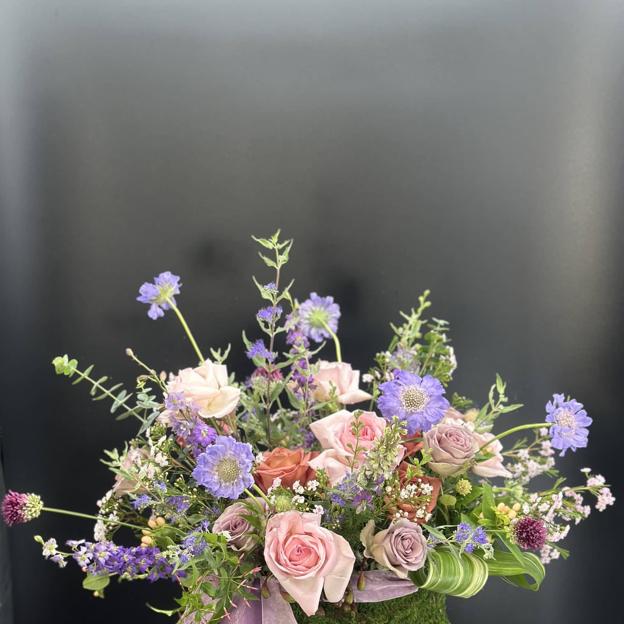 Refined ,low -profile floral arrangement composed of blush and rose -toned layered, photo 6 of 8