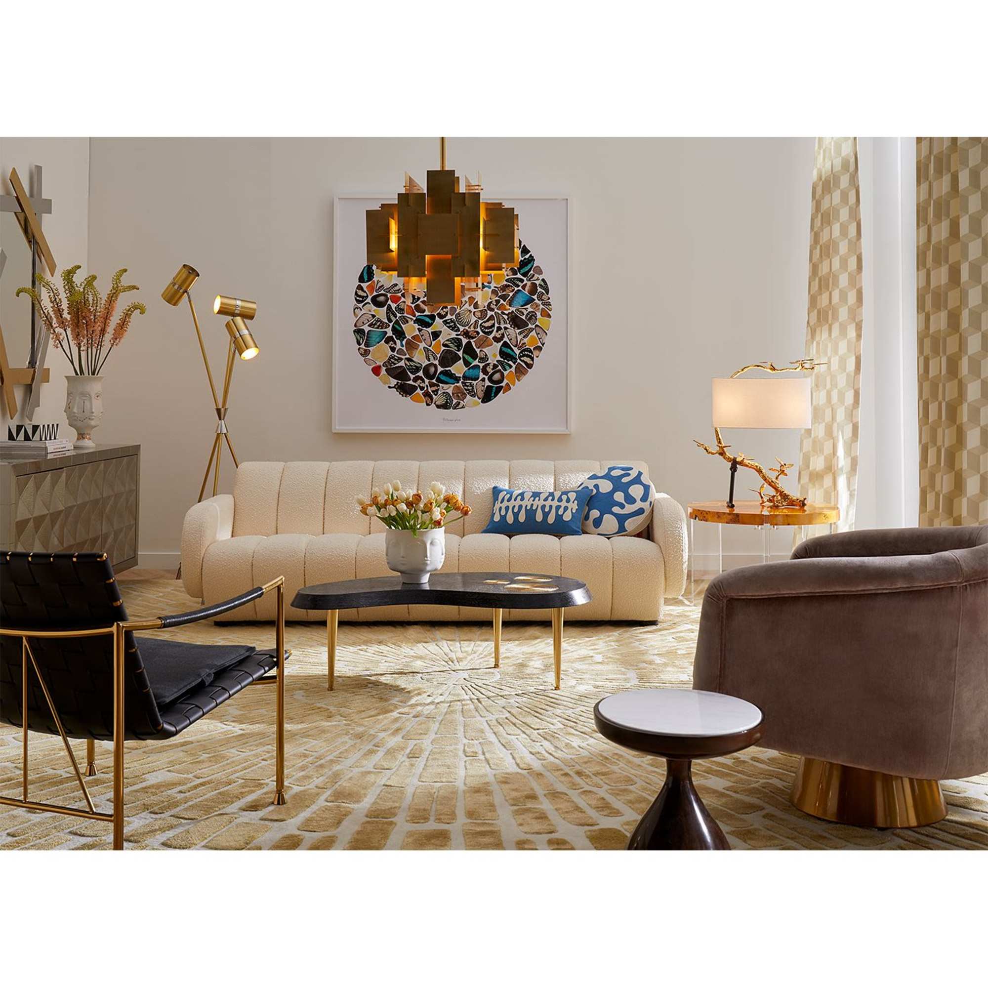 Vase of orange and white flowers on a coffee table in a living room
