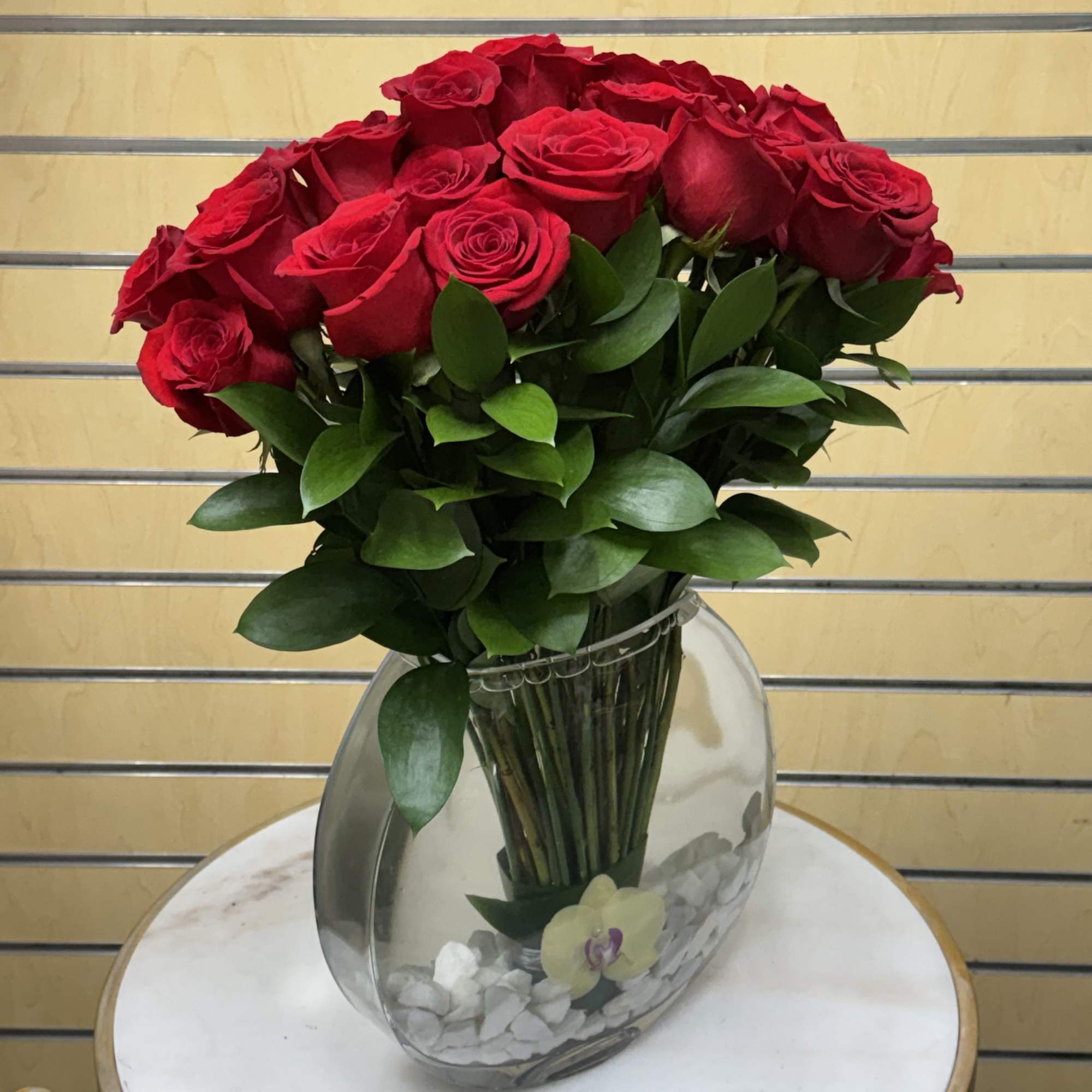 Bouquet of red roses in a clear glass vase