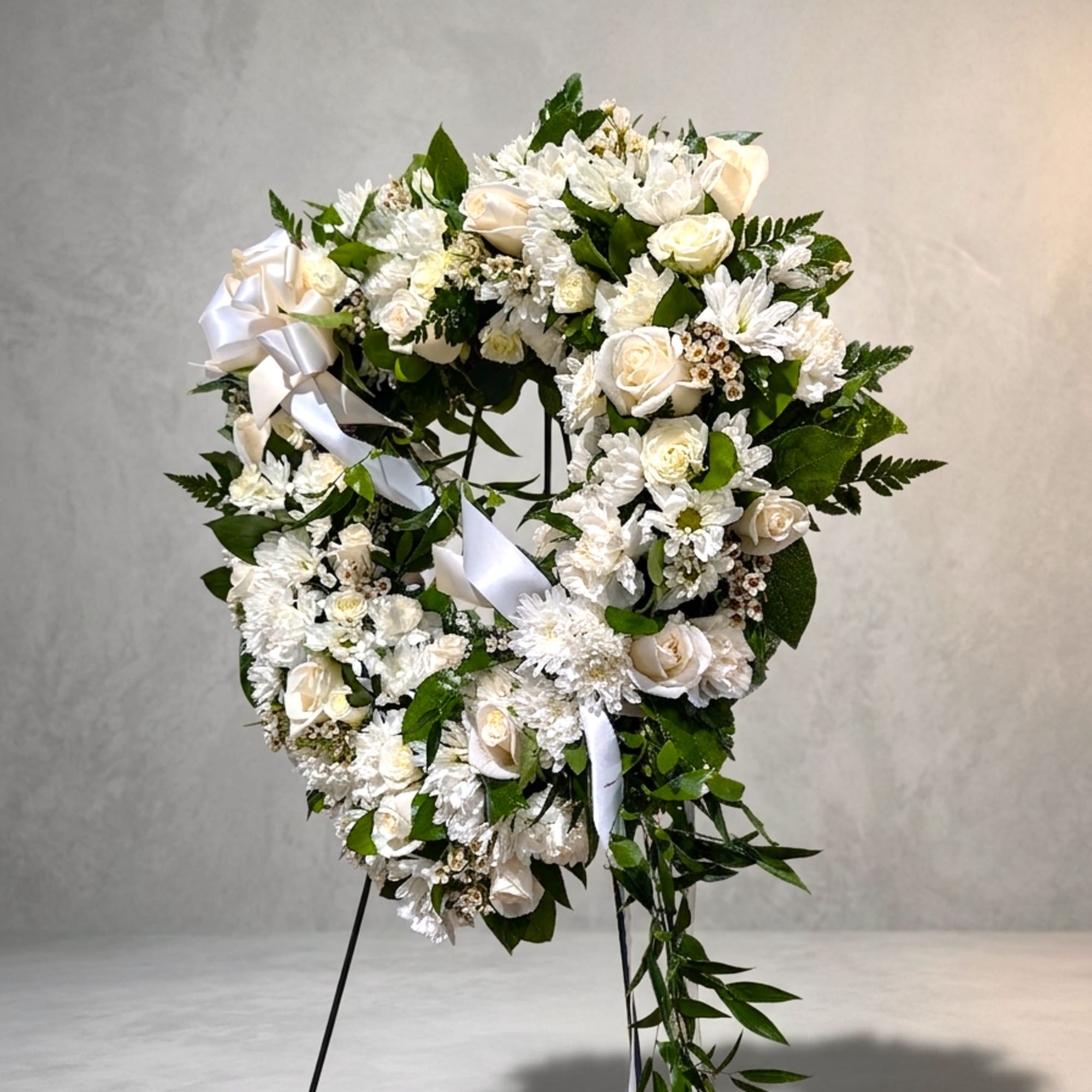 18" open heart decorated with white seasonal flowers accent with a bow., photo 2 of 3