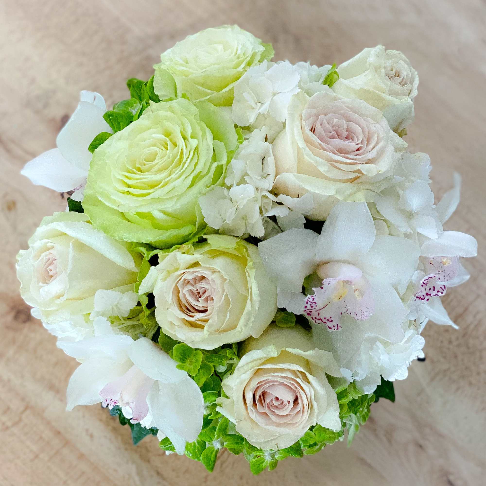 This elegant bouquet of cymbidium orchids, roses and hydrangeas arranged in a, photo 7 of 7