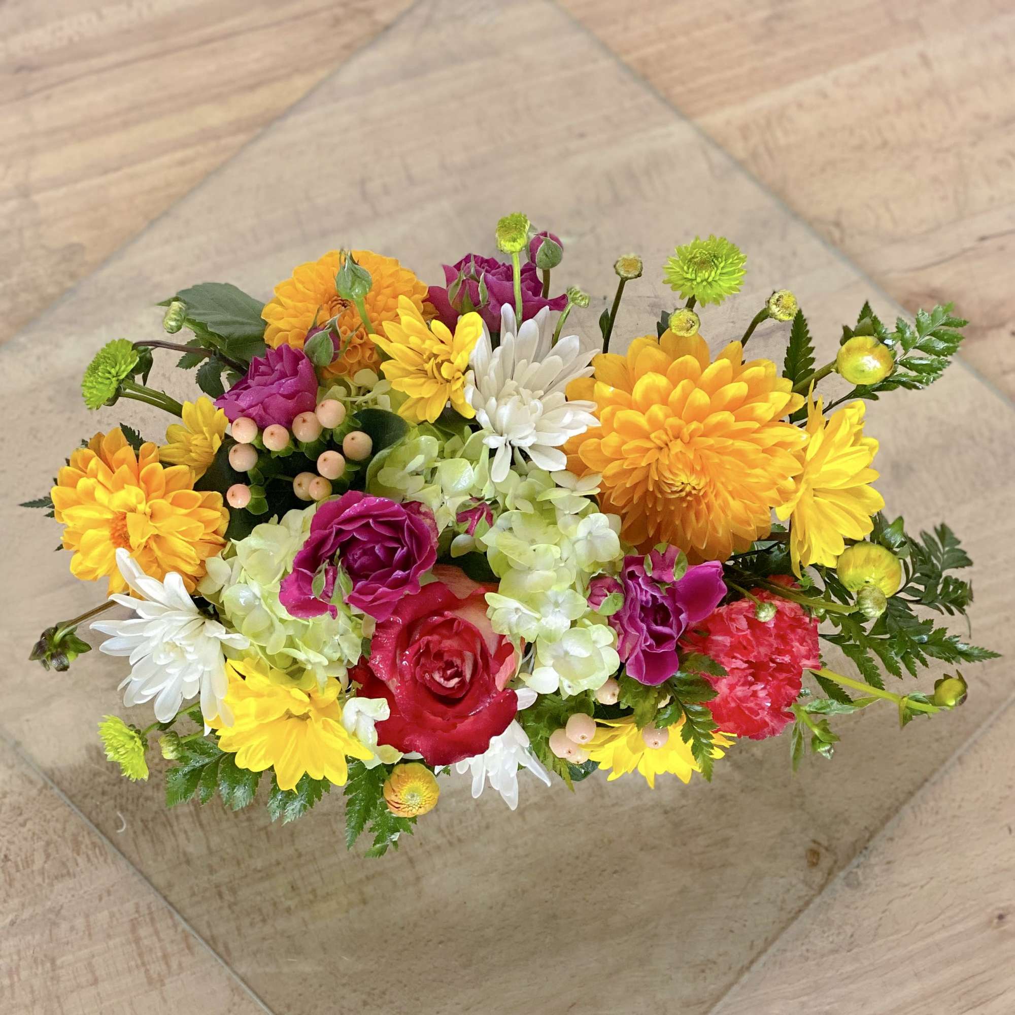 Colorful mixed bouquet with dahlias, roses, chrysanthemums, and hydrangea