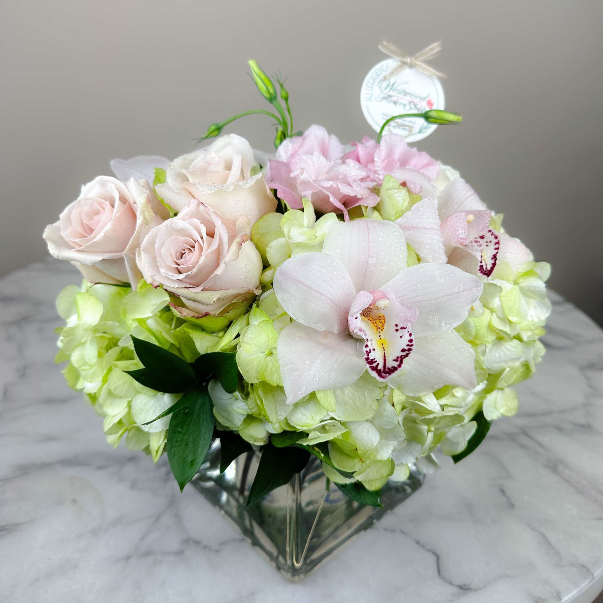 This elegant bouquet of cymbidium orchids, roses and hydrangeas arranged in a, photo 3 of 7