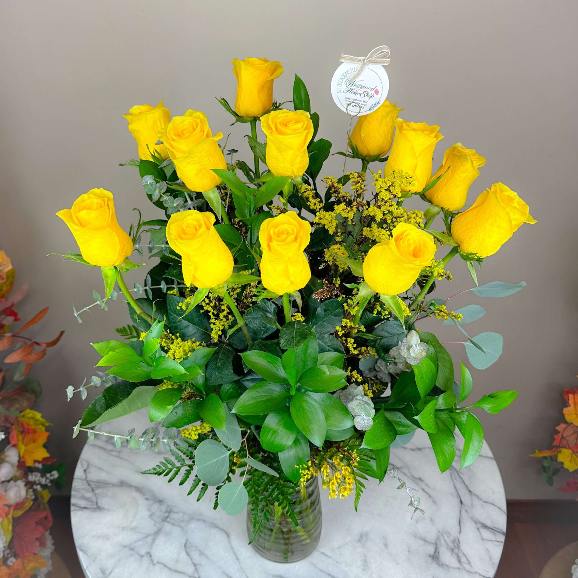 Bouquet of yellow roses in a clear glass vase