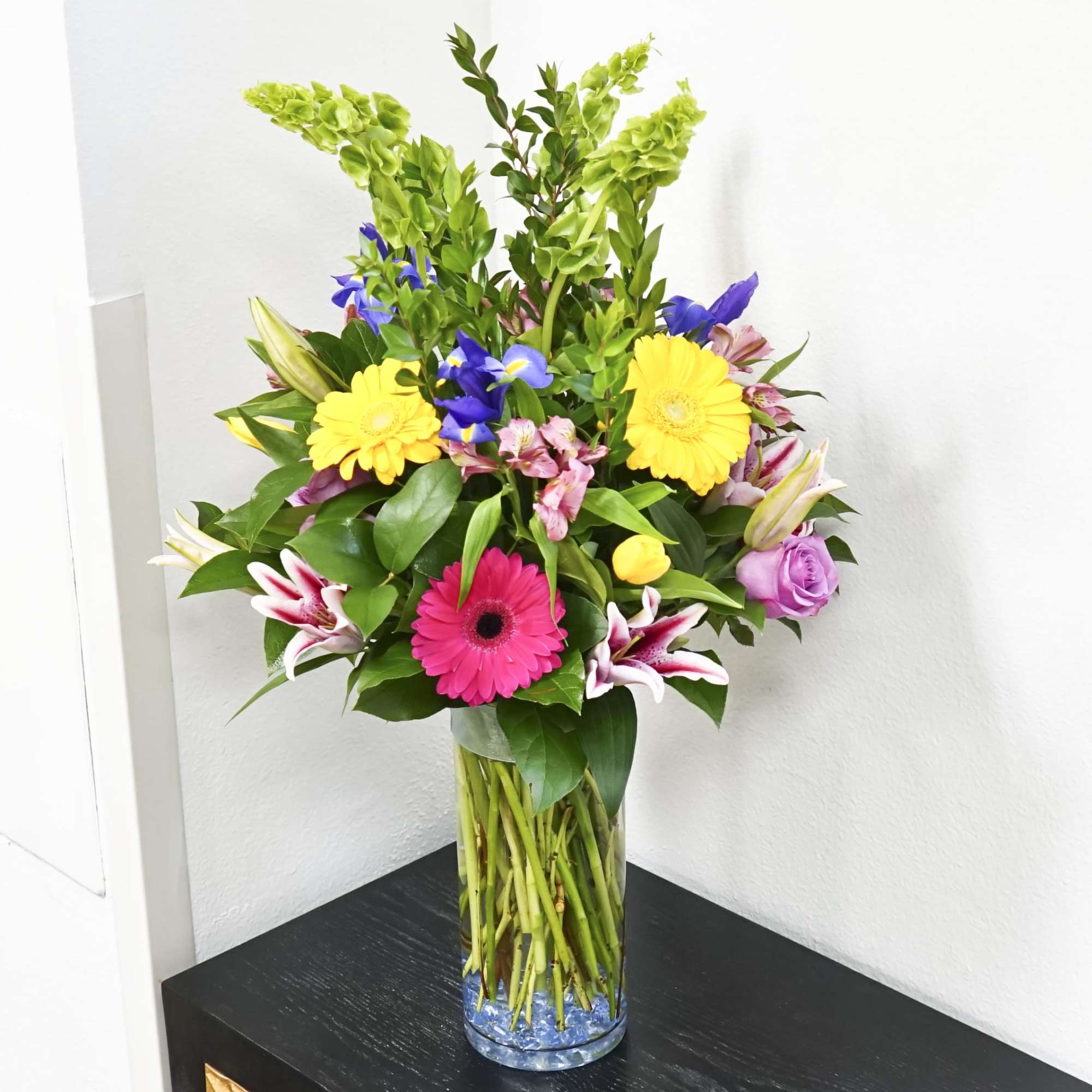 Colorful mixed bouquet in a clear glass vase