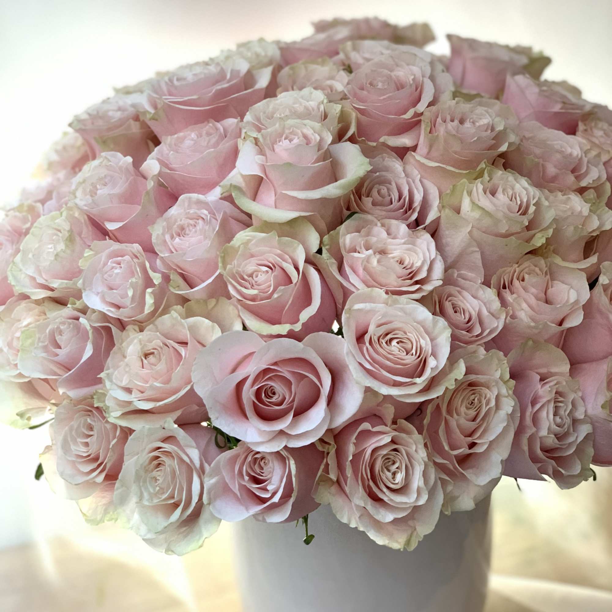 Bouquet of pale pink roses in a white vase, photo 3 of 3