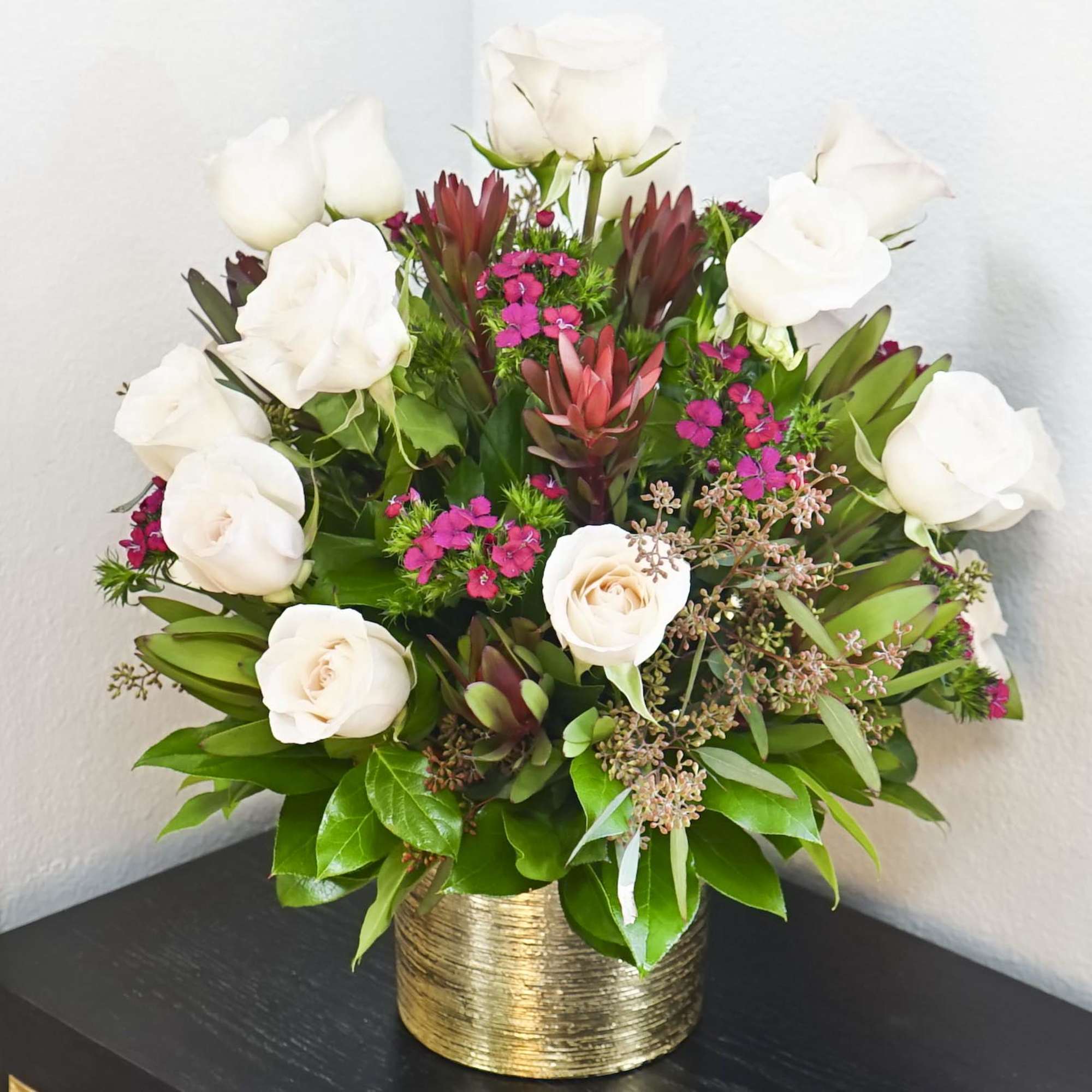 White roses and pink flowers arranged in a gold vase, photo 2 of 3