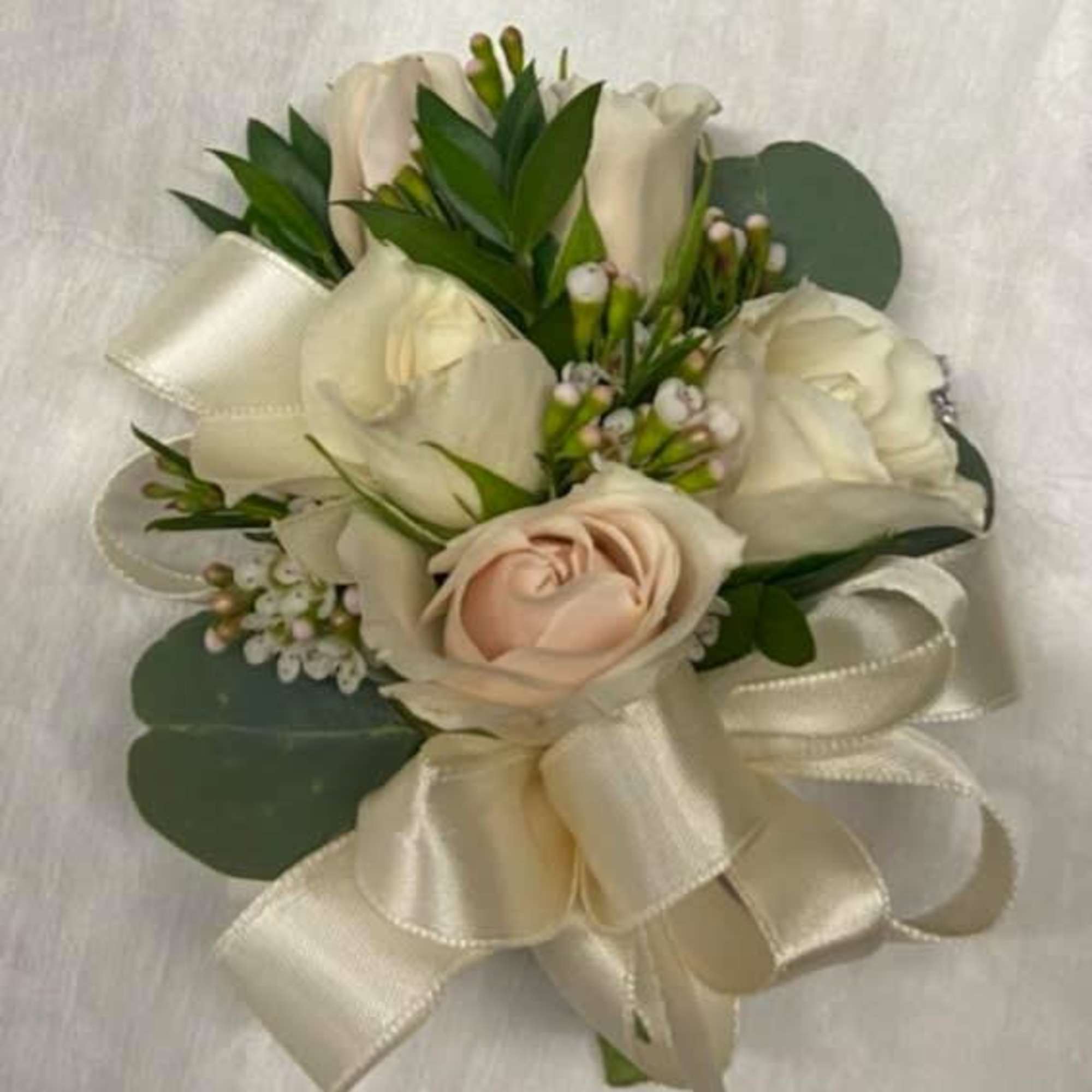 Cream and blush rose boutonniere with ivory ribbon