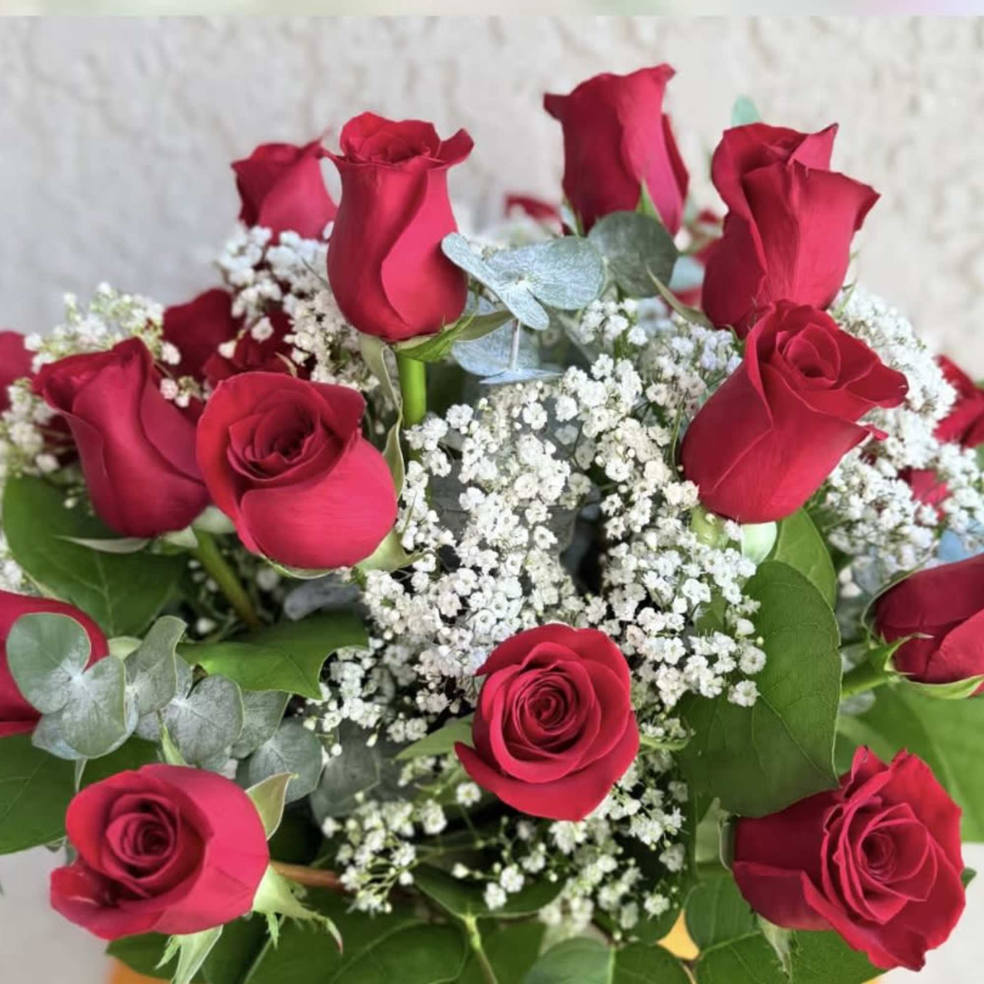 Bouquet of red roses with white baby's breath and eucalyptus