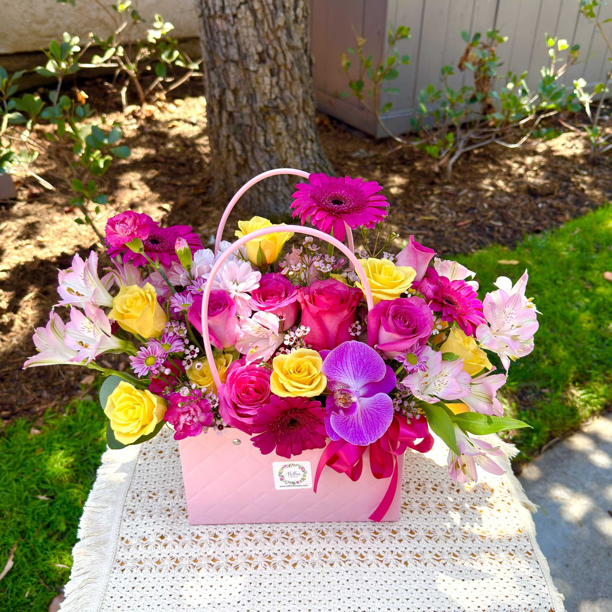Beautiful floral bag crafted with beautiful Ecuadorian roses, alstroemerias, fancy daisies, 