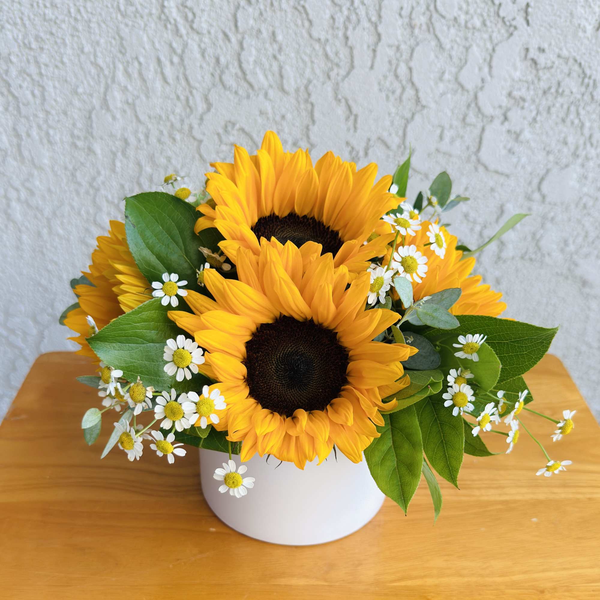 Sunflower bouquet in a white vase with small white daisies, photo 2 of 3