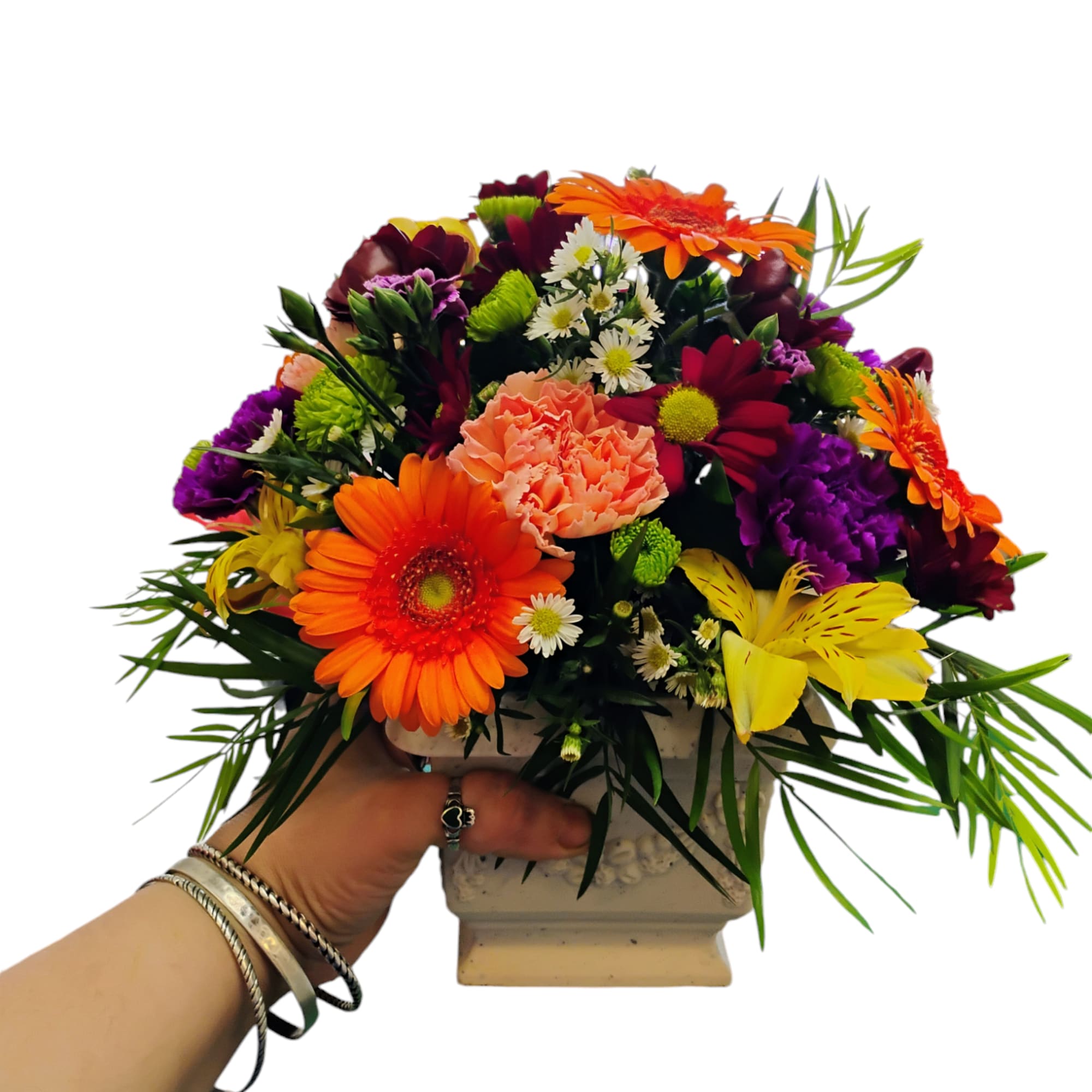 Colorful mixed flower arrangement in a square vase
