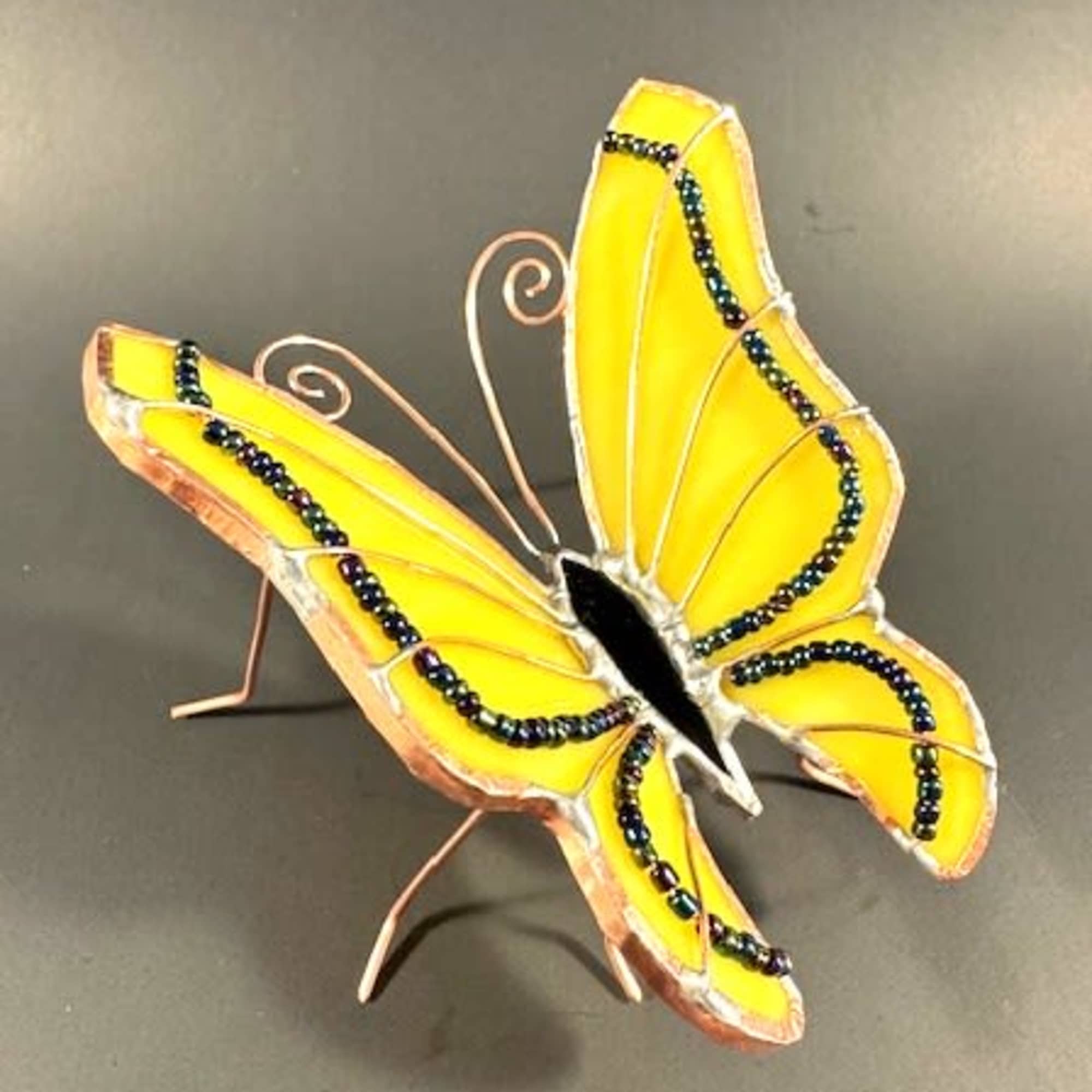 A bright yellow stained-glass butterfly catches the eye first - perfect as, photo 3 of 4