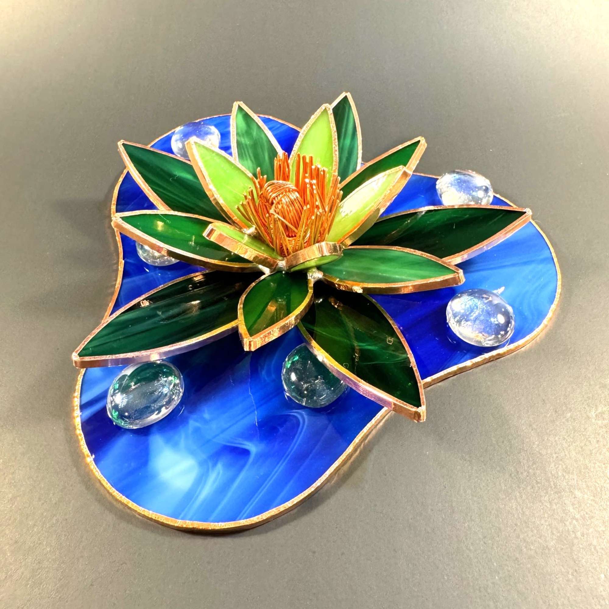 A sculptural stained-glass water lily that becomes a calming focal point -
