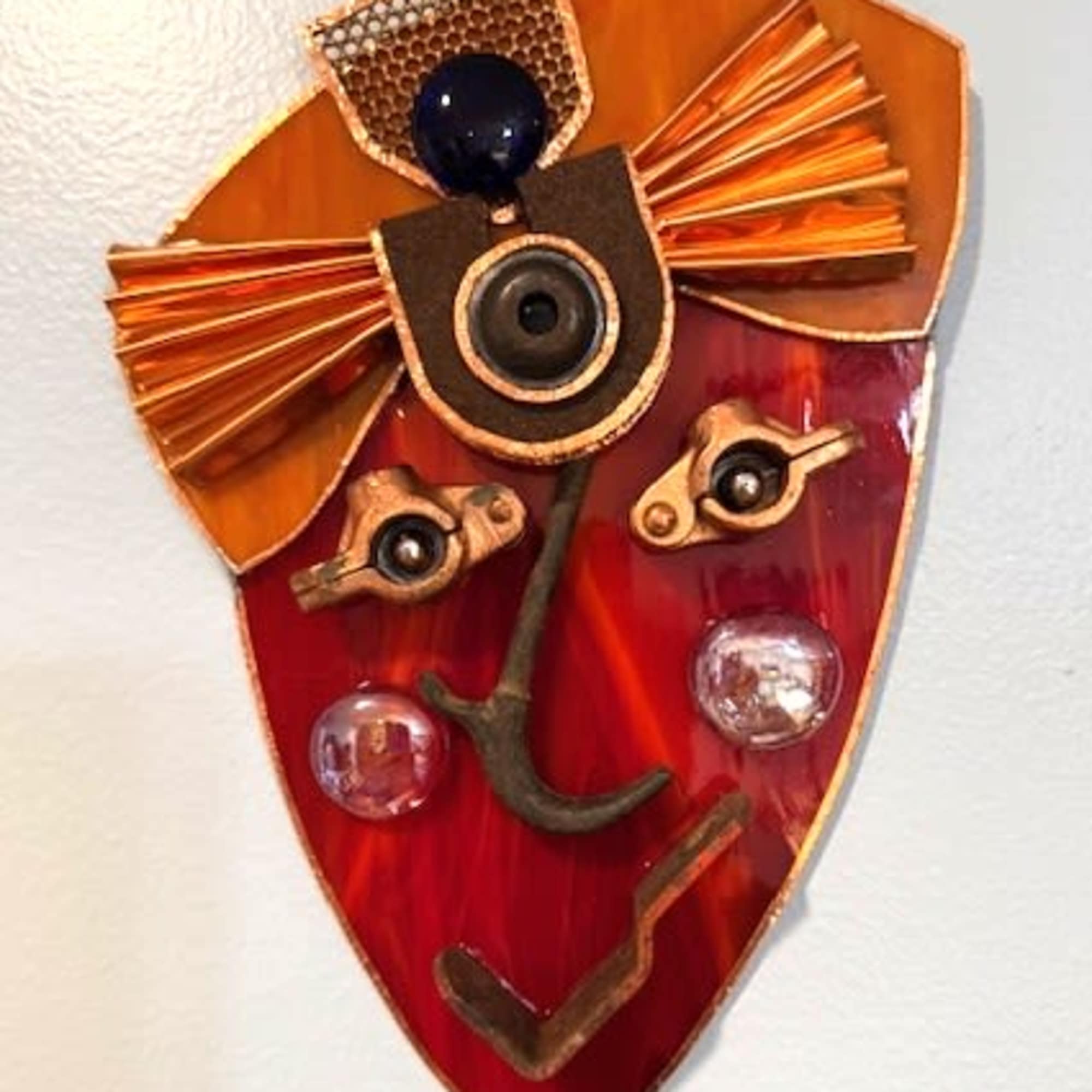 A striking red-and-orange stained glass wall mask that reads like a modern, photo 2 of 2