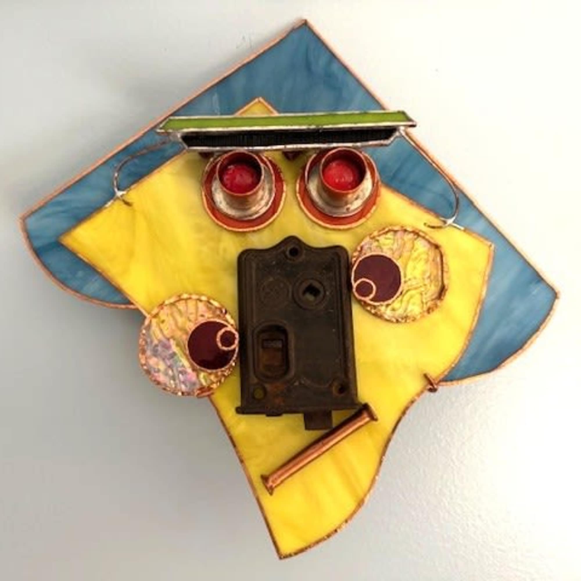 A geometric, upcycled wall sculpture that reads like a playful portrait-this mask, photo 2 of 2