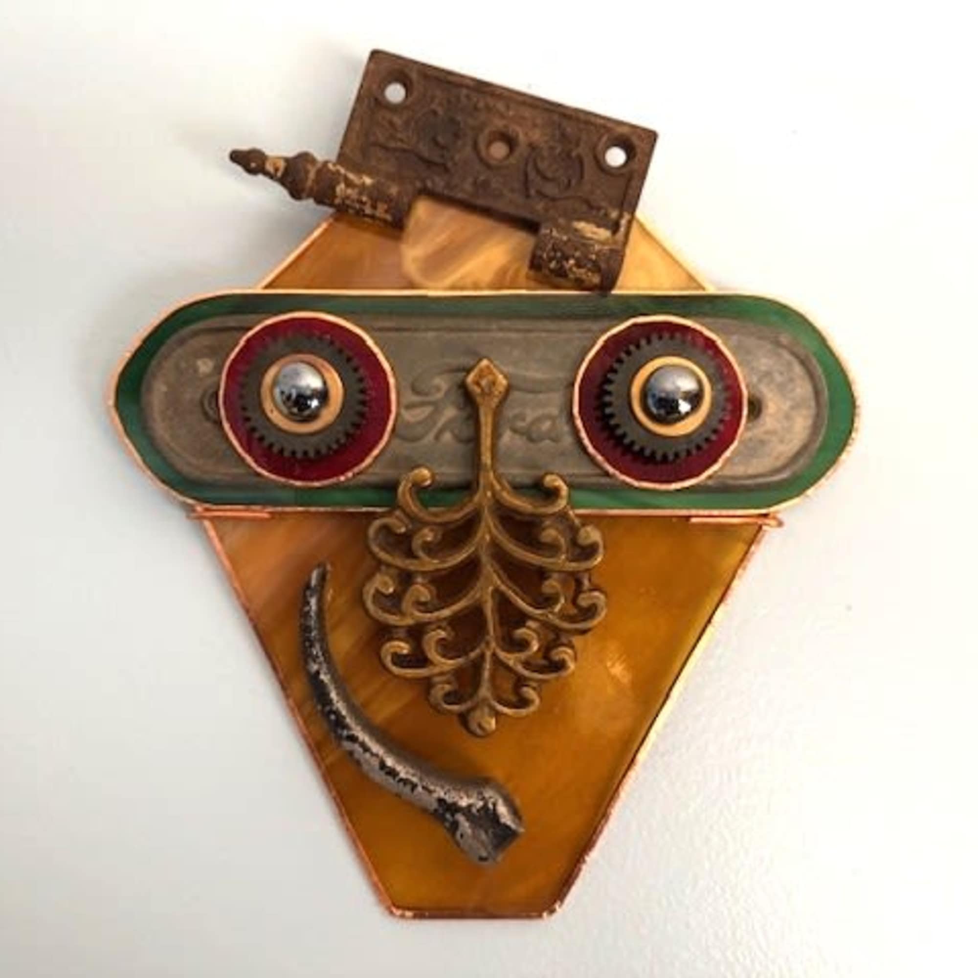 A whimsical steampunk-inspired wall sculpture that reads like a quirky mask -, photo 2 of 2