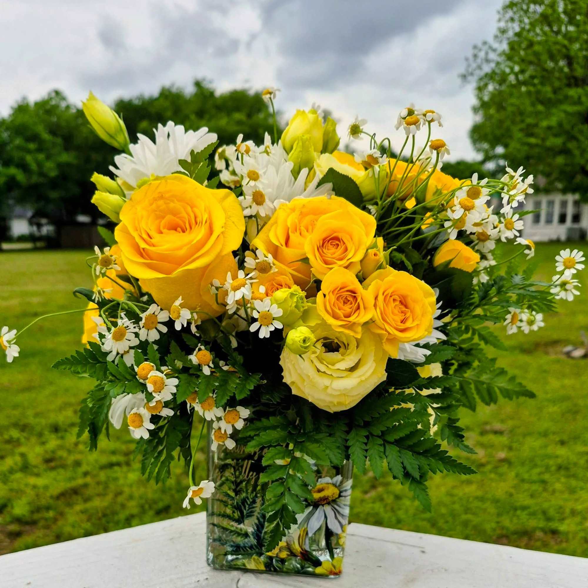 Bring a breath of fresh air indoors with this cheerful, garden-inspired arrangement
