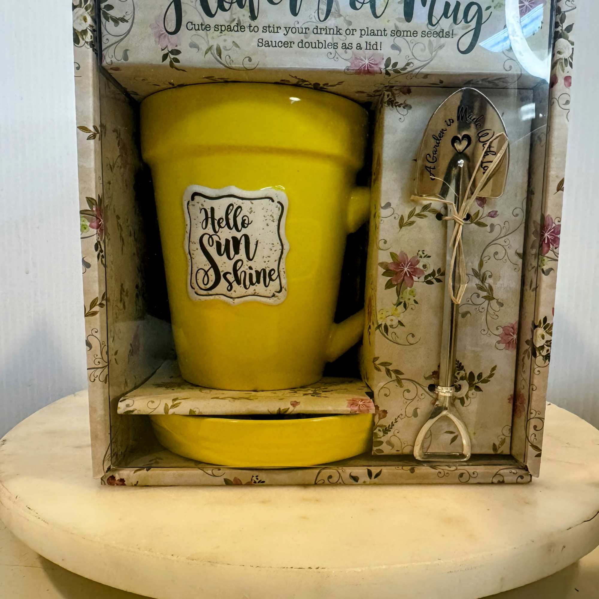 Yellow mug gift set in floral packaging with a matching spoon