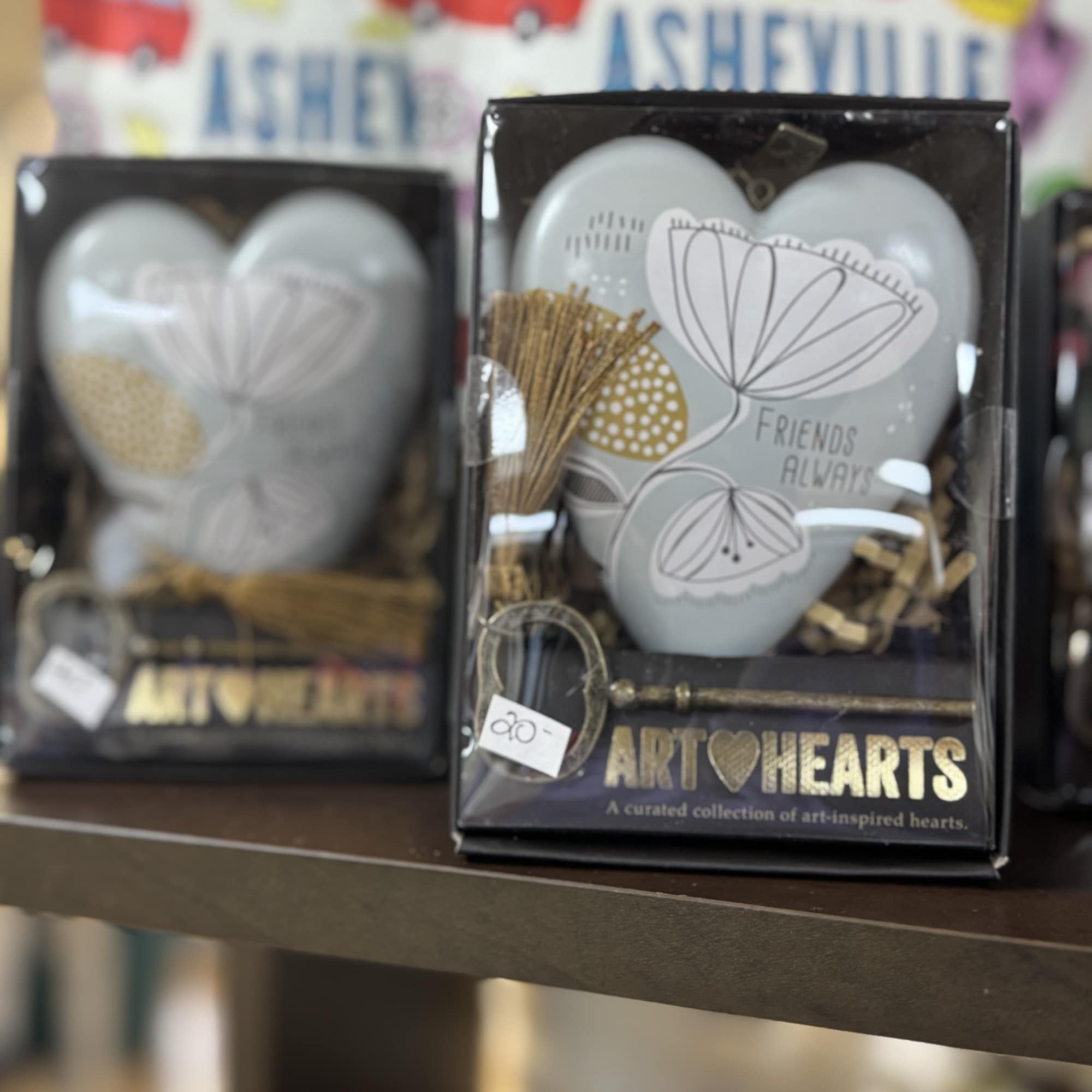 Decorative heart-shaped gift boxes with a "Friends Always" design