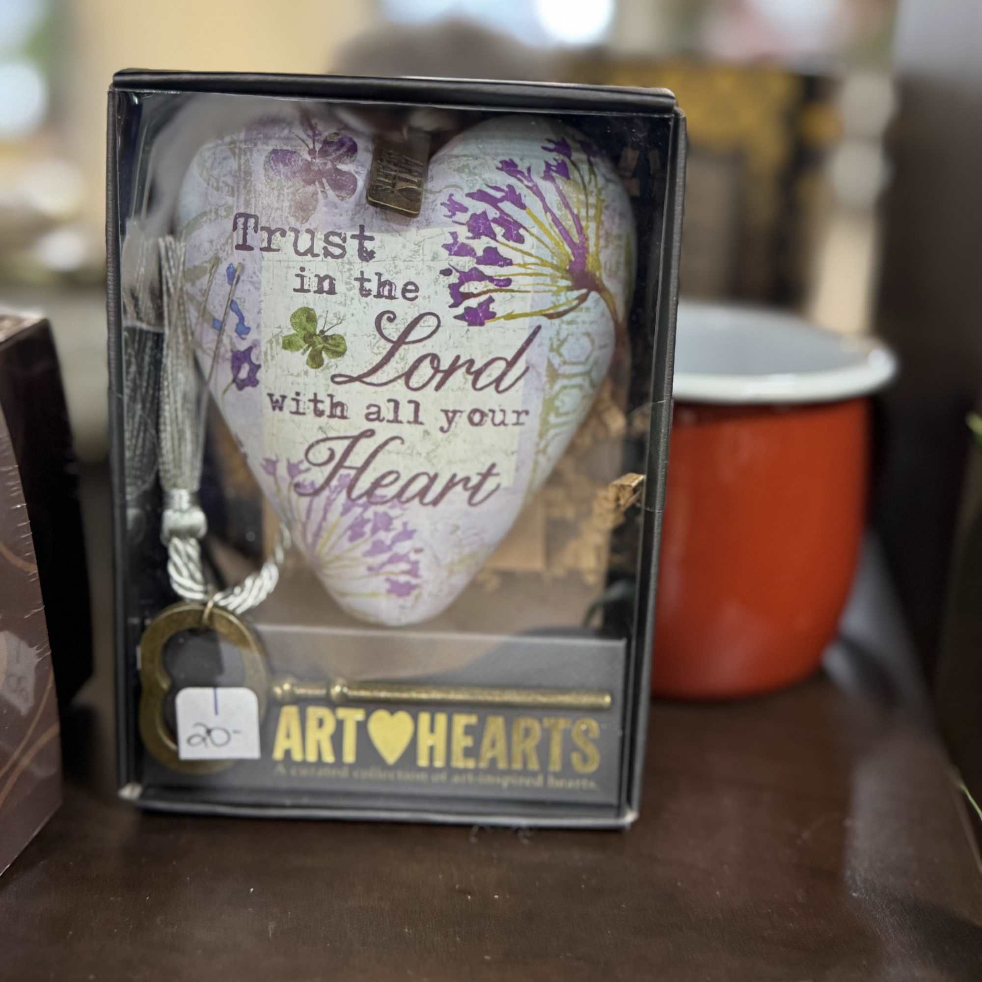 Decorative heart-shaped ornament in a gift box with a cord and keychain