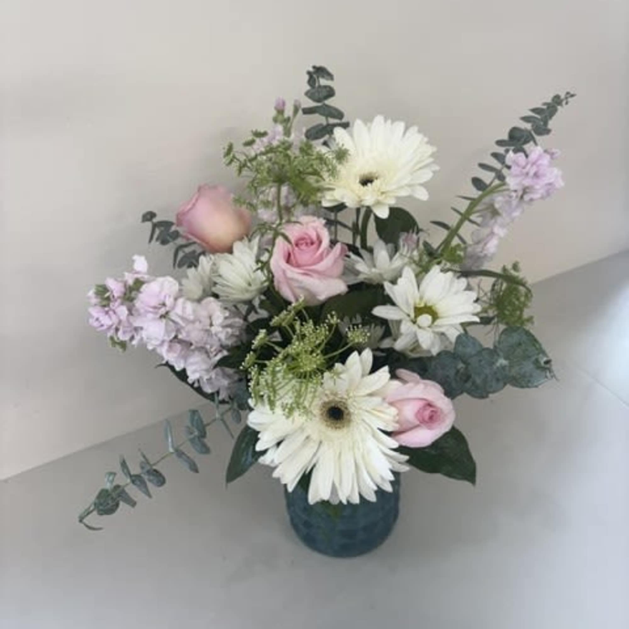Cloud Nine Blooms is a dreamy arrangement featuring soft pastel hues in