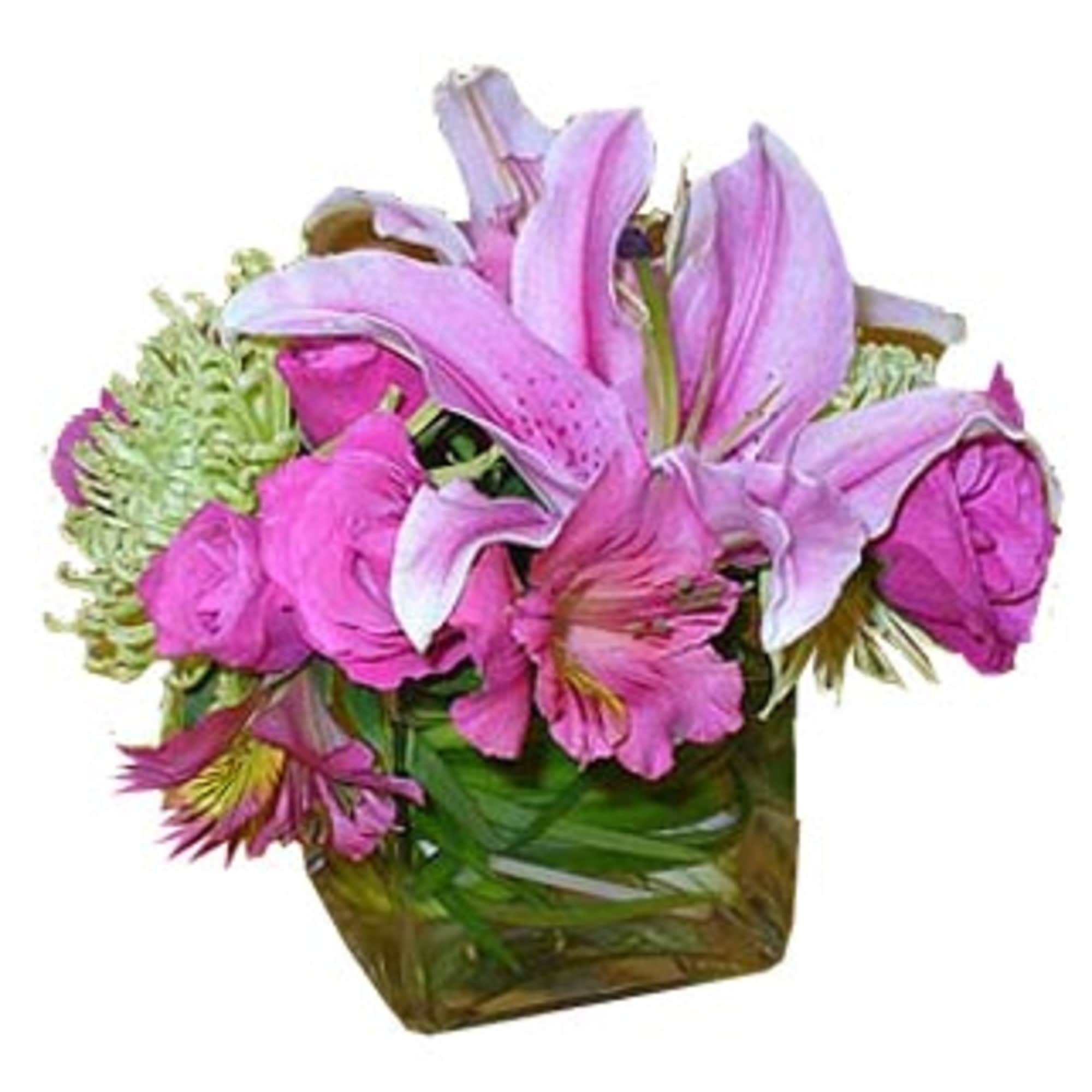 Compact pink lilies and roses with green mums in a clear glass cube vase